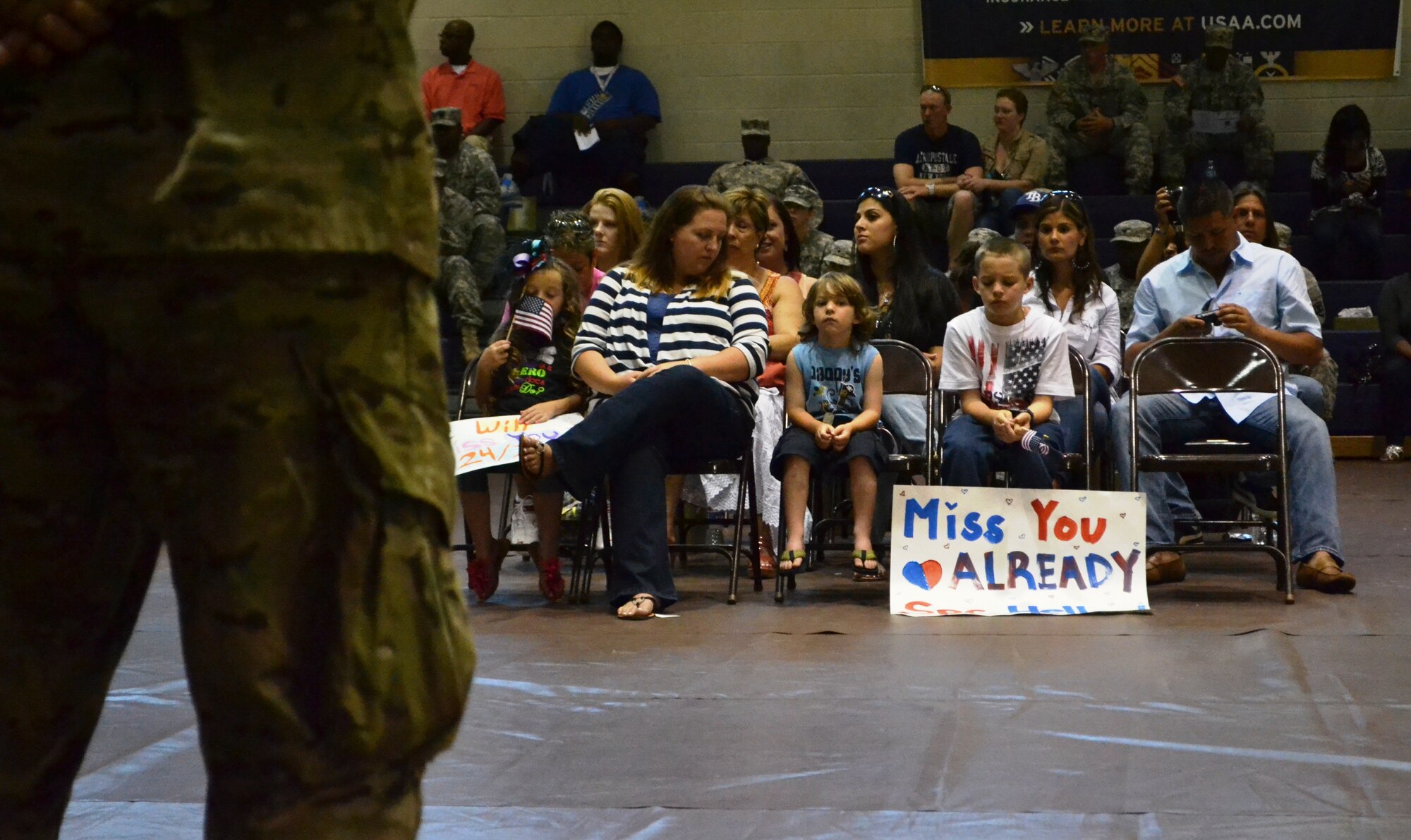 Friends and families watch as the 358th Automated Cargo Documentation Detachment, 10th Transportation Battalion, 7th Sustainment Brigade get set to depart to Afghanistan after the “Scan Devils” deployment ceremony at the McClellan Fitness Center at Ft. Eustis, Va., June 7, 2012. The “Scan Devils” will focus on troops coming back home as the Afghan Army takes over combat and sustainment operations in their country. (U.S. Army photo by Sgt. Edwin