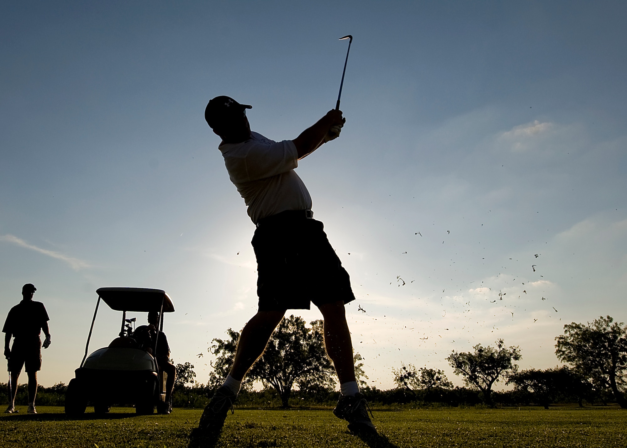 U.S. Air Force Maj. Patrick Bass, 7th Security Forces Squadron commander, swings his club during the Commander’s Farewell Golf Tournament at Dyess Air Force Base, Texas. Servicemembers throughout Dyess came out to Mesquite Grove Golf Course for the tournament. The participants played nine holes during the day and nine holes at night. (U.S. Air Force photo by Airman 1st Class Damon Kasberg /Released)