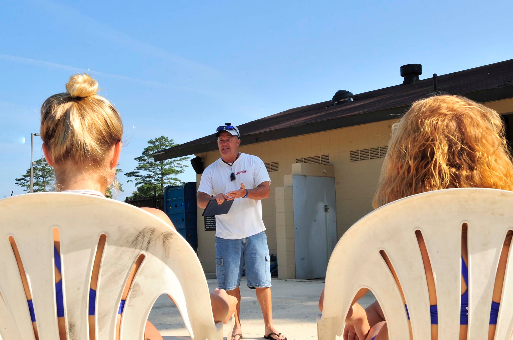 Tim Godwin, 20th Force Support Squadron director of outdoor activities, teaches a lifeguard in-service emergency training class to the Woodland Pool lifeguards at Shaw Air Force Base, S.C., May 31, 2012.  On May 25, the pool opened for the swim season.(U.S. Air Force photo by Airman Nicole Sikorski/Released)