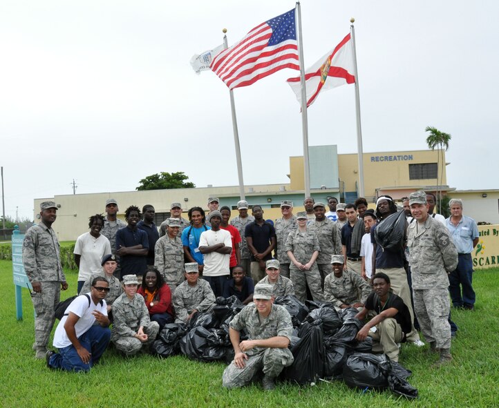 Airmen from Homestead Air Reserve Base along with students of Homestead Job Corps clean up roadside trash along 10 blocks of South West 288th St. in support of Adopt A Highway in Homestead, Fla., June 7. The base has partnered with Job Corps on multiple occasions to provide outreach to the area. (U.S. Air Force photo/Ross Tweten)