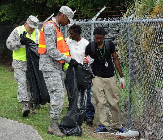Airmen from Homestead Air Reserve Base along with students of Homestead Job Corps clean up roadside trash along 10 blocks of South West 288th St. in support of Adopt A Highway in Homestead, Fla., June 7. The base has partnered with Job Corps on multiple occasions to provide outreach to the area. (U.S. Air Force photo/Ross Tweten)