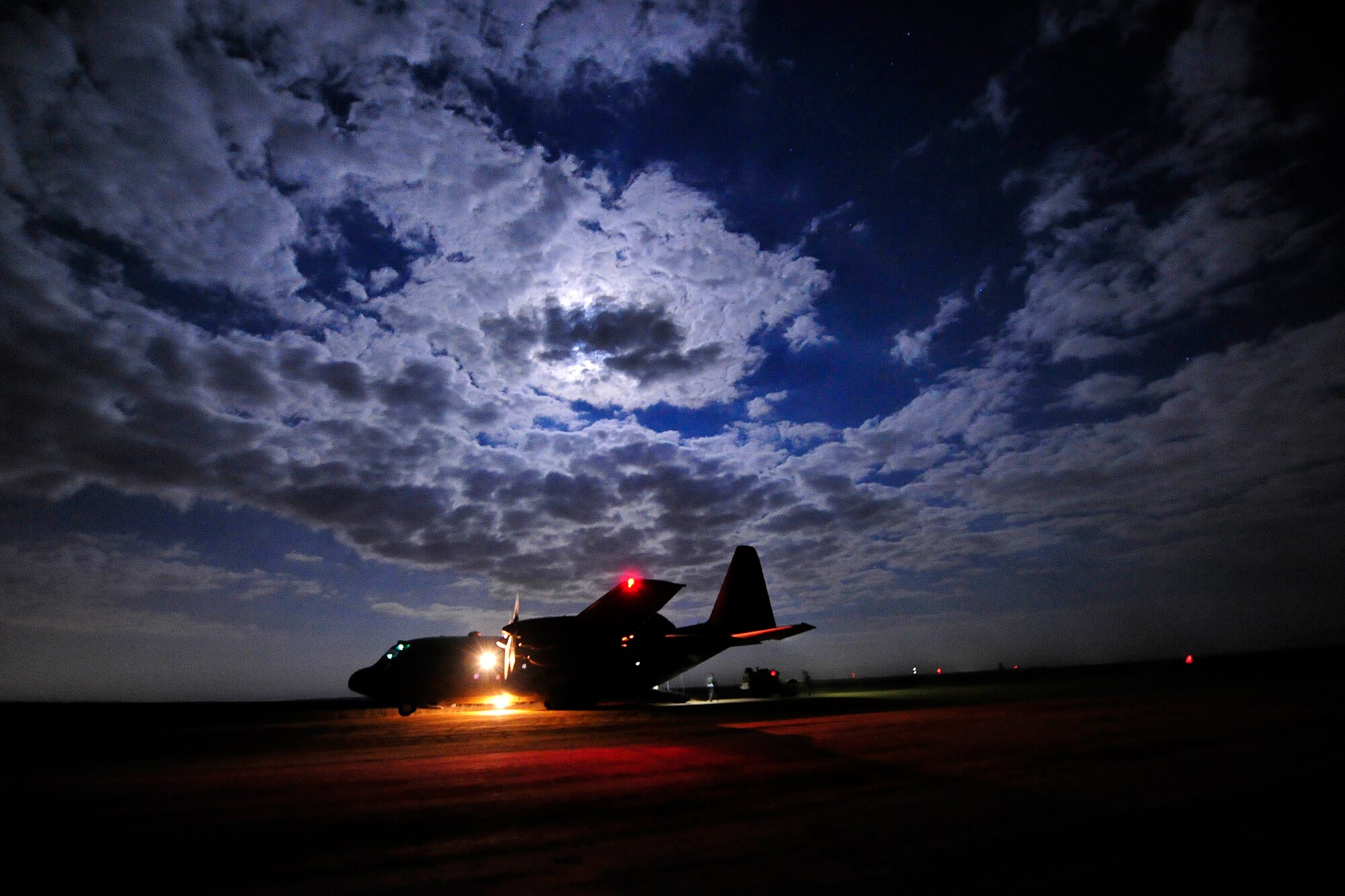 A C-130 Hercules conducts air mobility operations at  Holland Landing Zone on Fort Bragg, N.C. during Joint Operations Access Exercise 12-02, June 7. JOAX is a two-week forcible entry and ground combat exercise to prepare Air Force and Army service members to respond to worldwide crises and contingencies.(U.S. Air Force photo by Tech. Sgt. Parker Gyokeres)