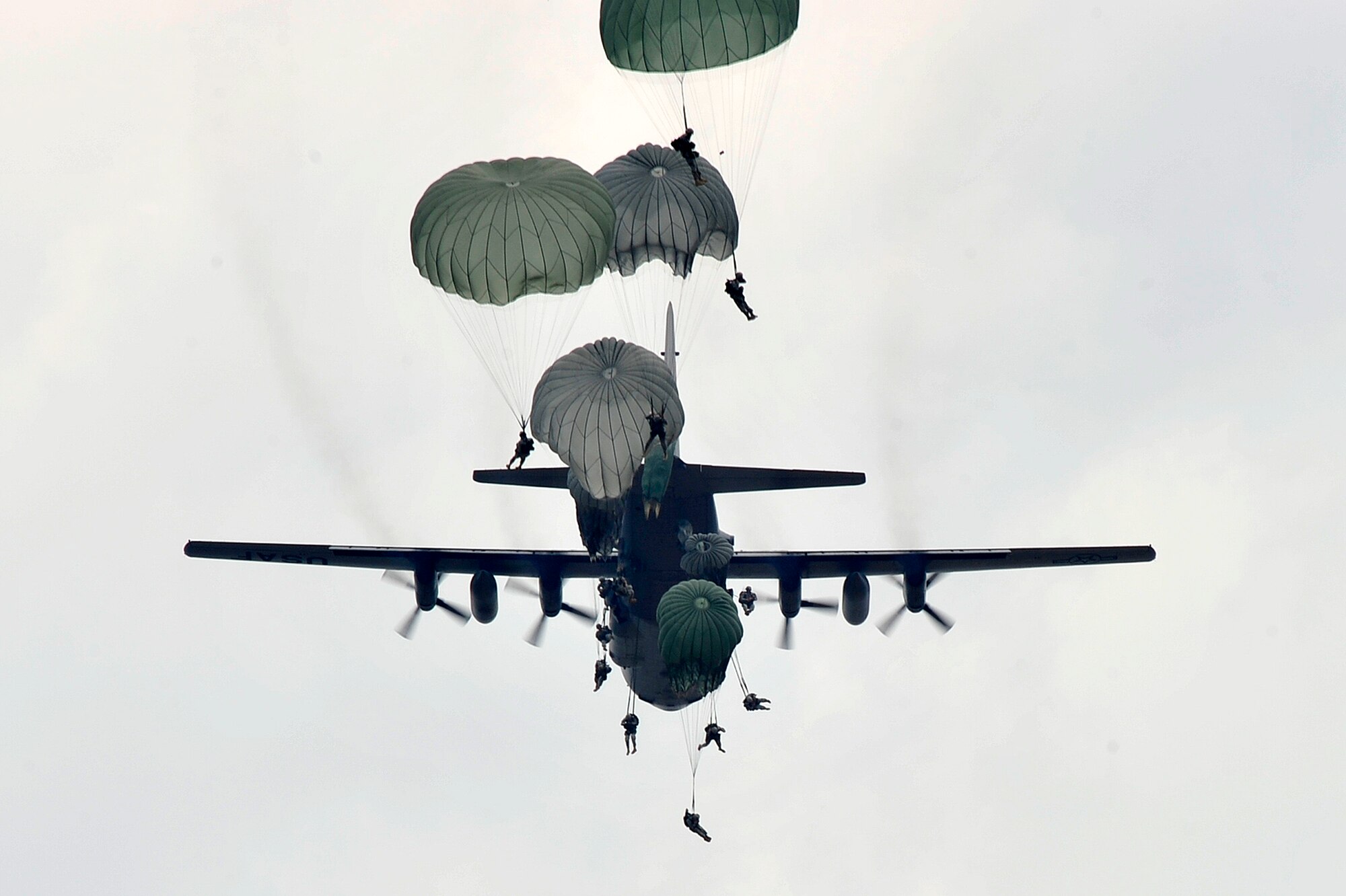 A C-130 Hercules drops U.S. Army paratroopers of the 82nd Airborne Division onto Luzon drop zone during a training mission prior to Joint Operations Access Exercise 12-02 at Mackall Army Airfield, N.C., June 4. JOAX is a two-week forcible entry and ground combat exercise to prepare Air Force and Army service members to respond to worldwide crises and contingencies. (U.S. Air Force photo by Tech. Sgt. Parker Gyokeres)