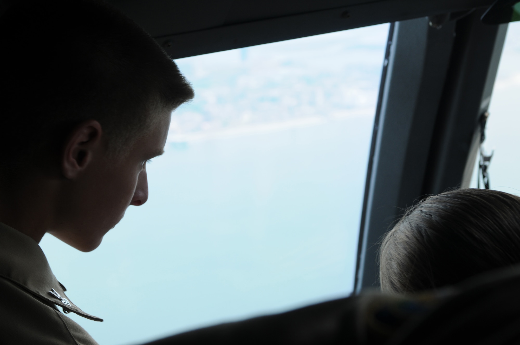 Junior ROTC cadet Joseph Czajkowski of the Delaware Military Academy peers out a flight deck window of a C-17 Globemaster III June 9, 2012. For approximately an hour, the aircraft traveled to the airspace above Ocean City, Md., before returning to Dover Air Force Base, Del. (U.S. Air Force photo by Senior Airman Joe Yanik)