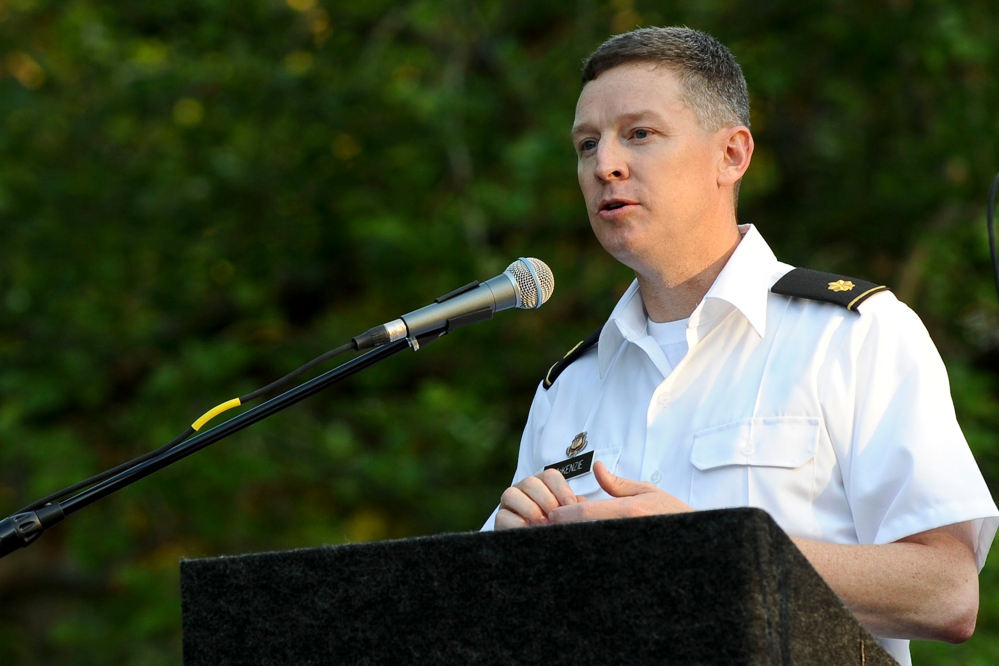 U.S. Army Maj. Scott McKenzie, the U.S. Army Training and Doctrine Command Band commander and conductor, greets a crowd of 500 during the “Music Under the Stars” concert series opener at Ft. Eustis' Magnolia Park, June 7, 2012.  The concert was the first of 13 shows the band will perform each Thursday night at the through the end of August. (U.S. Air Force photo by Senior Airman Wesley Farnsworth/Released)