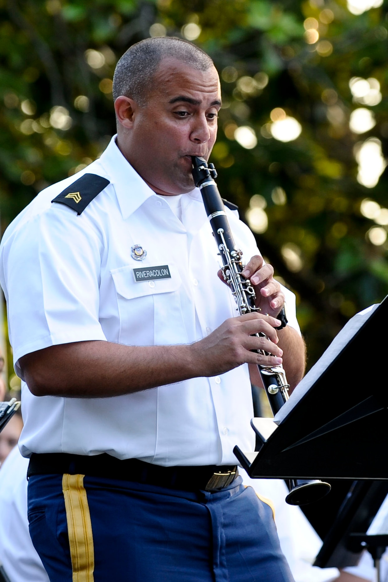 U.S. Army Sgt. Luis Rivera, U.S. Army Training and Doctrine Command Band clarinetist, performs a solo during a song, at Fort Eustis, Va., during the “Music Under the Stars” concert series opener at Ft. Eustis' Magnolia Park, June 7, 2012. The band will perform a concert every Thursday night at Magnolia Park through the end of August. (U.S. Air Force photo by Senior Airman Wesley Farnsworth/Released)
