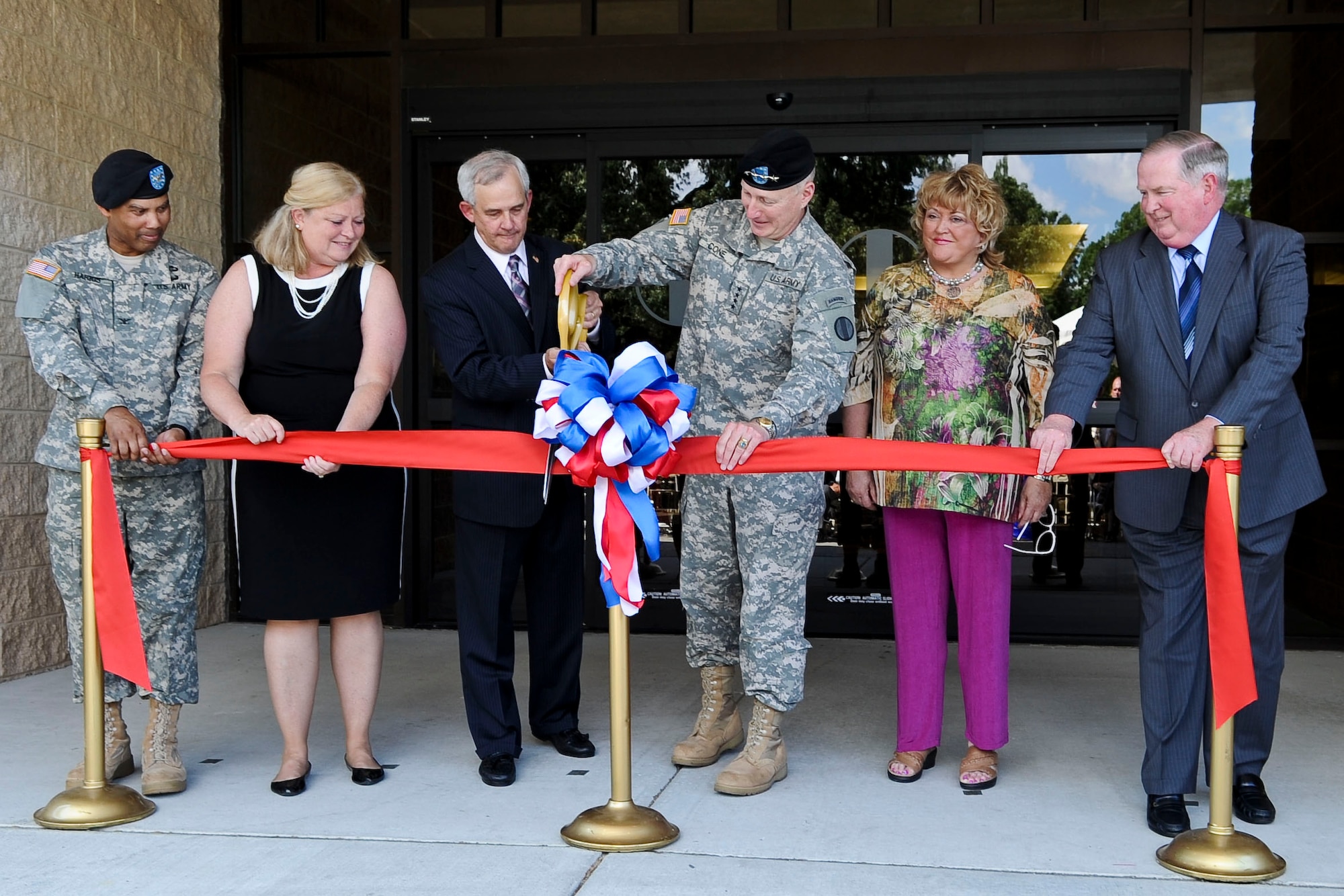 U.S. Army Gen. Robert W. Cone, commanding general of the U.S. Army Training and Doctrine Command, joins family members of the late Gen. Donn Starry in cutting the ribbon to ceremonially reopen Ft. Eustis' Building 611 as “Starry Hall,” June 8, 2012. The building was renamed for General Starry, a prolific commanding general of TRADOC and the architect of the Army doctrine FM-100-5, “AirLand Battle,” which modernized the Army's warfighting concepts. (U.S. Air Force photo by Senior Airman Wesley Farnsworth/Released)