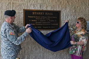 U.S. Army Gen. Robert W. Cone, left, U.S. Army Training and Doctrine Command commanding general, and Karen Starry, unveil the dedication plaque at Ft. Eustis' Starry Hall, June 8, 2012. The building was renamed for Karen's late husband, Gen. Donn Starry, a prolific commanding general of TRADOC and the architect of the Army doctrine FM-100-5, “AirLand Battle,” which modernized the Army's warfighting concepts. (U.S. Air Force photo by Senior Airman Wesley Farnsworth/Released)