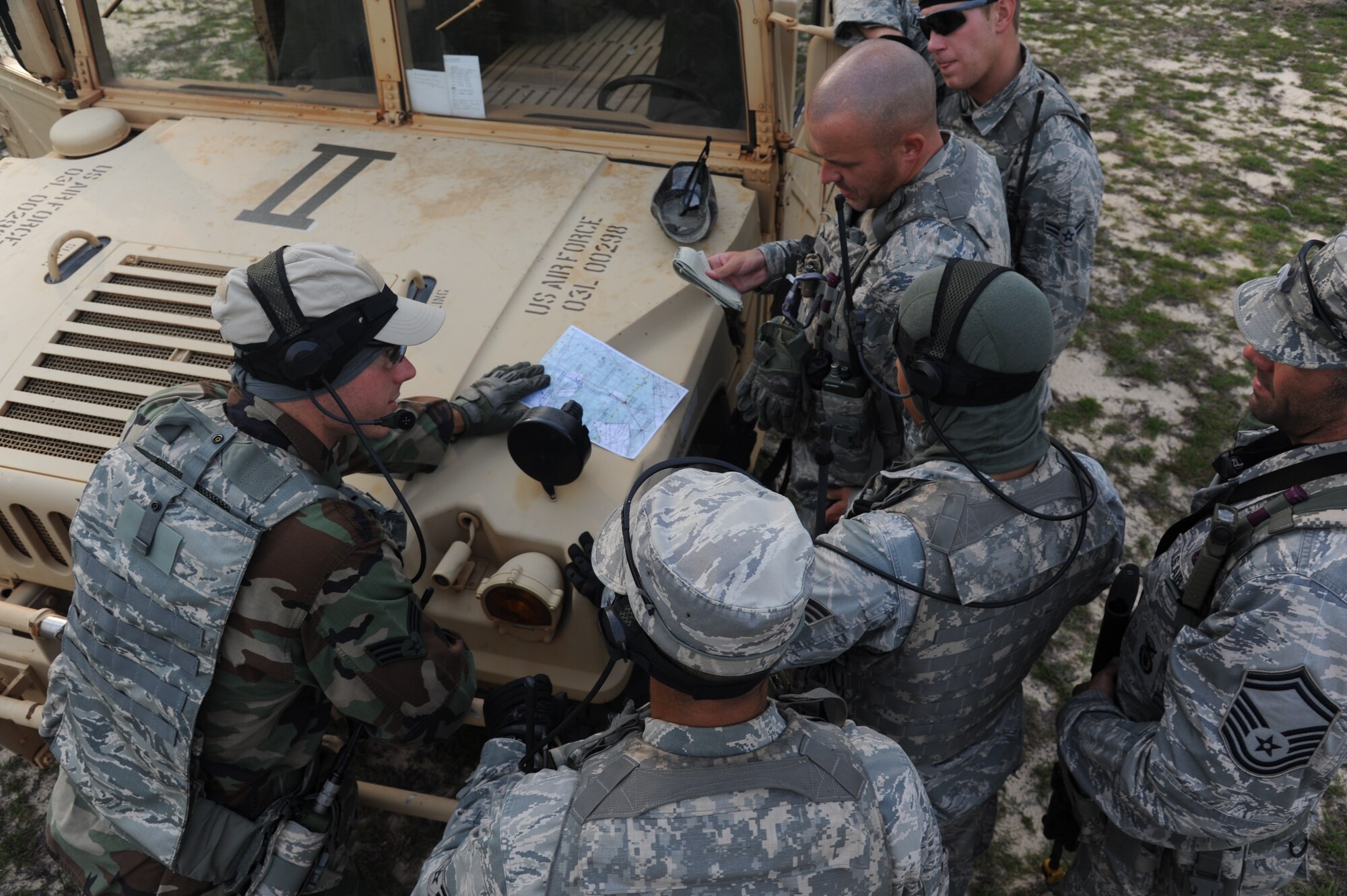 Deployed Air Ground Response Element candidates study a map May 15, 2012 as part of their four-day field exercise which is the culmination of the DAGRE Qualification Course held at Hurlburt Field, Fla. The DAGRE qualification equips security forces personnel with the skill set to provide enhanced security for special operations forces. (U.S. Air Force photo/Rachel Arroyo)