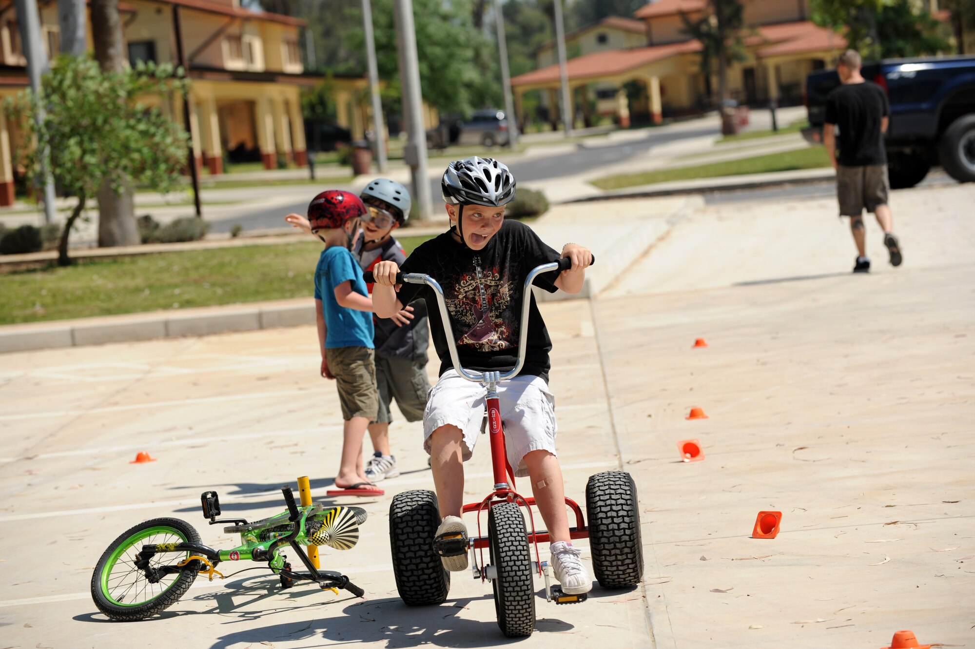 A boy careens through a serpentine-shaped course during a Bicycle Safety Rodeo June 9, 2012, at Incirlik Air Base, Turkey. The obstacle course taught riders to be cognizant of their surroundings and maneuver quickly to avoid accidents. (U.S. Air Force photo by Senior Airman Jarvie Z. Wallace/Released)