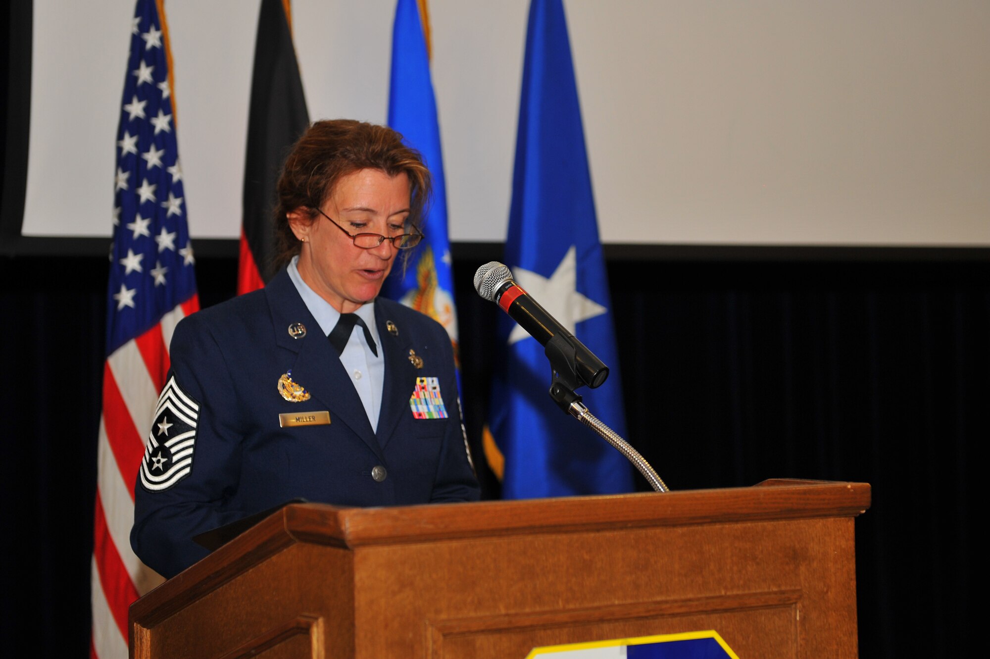 SPANGDAHLEM AIR BASE, Germany – Chief Master Sgt. Sandra Miller, 52nd Fighter Wing command chief, gives closing remarks during her retirement ceremony inside the Club Eifel ballroom here June 8. Miller retired after 29 years of service and more than 150 people attended the ceremony to celebrate her transition into civilian life. (U.S. Air Force photo by Airman 1st Class Dillon Davis/Released)