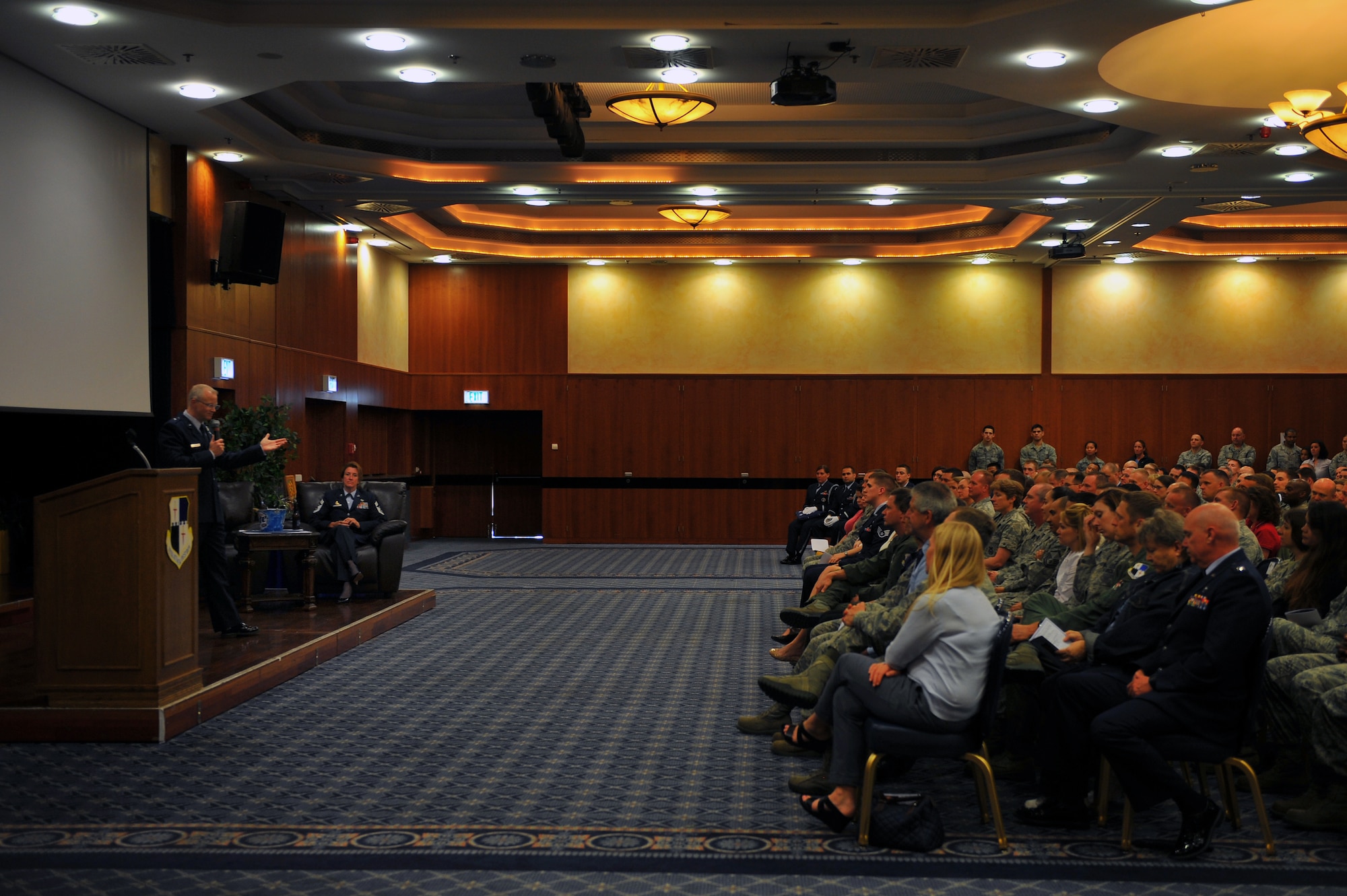 SPANGDAHLEM AIR BASE, Germany – Brig. Gen. Chris Weggeman, left, 52nd Fighter Wing commander, gives his remarks during the retirement of Chief Master Sgt. Sandra Miller, 52nd FW command chief, inside the Club Eifel ballroom here June 8. Miller retired after 29 years of service and more than 150 people attended the ceremony to celebrate her transition into civilian life. (U.S. Air Force photo by Airman 1st Class Dillon Davis/Released)