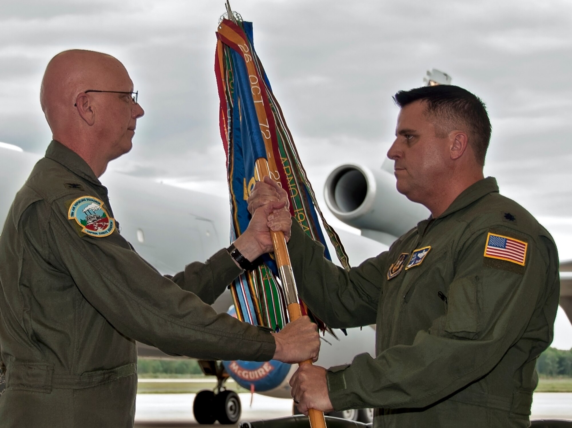 Lt. Col. Michael Cruff (right) recieves the 78th Aerial Refueling Squadron's guidon from Col. Michael Underkofler, 514th Air Mobility Wing commander, during a change-of-command ceremony here June 9. Cruff assumed command of the squadron from Lt. Col. Dan Edwards. (U.S. Air Force photo by Shawn J. Jones)