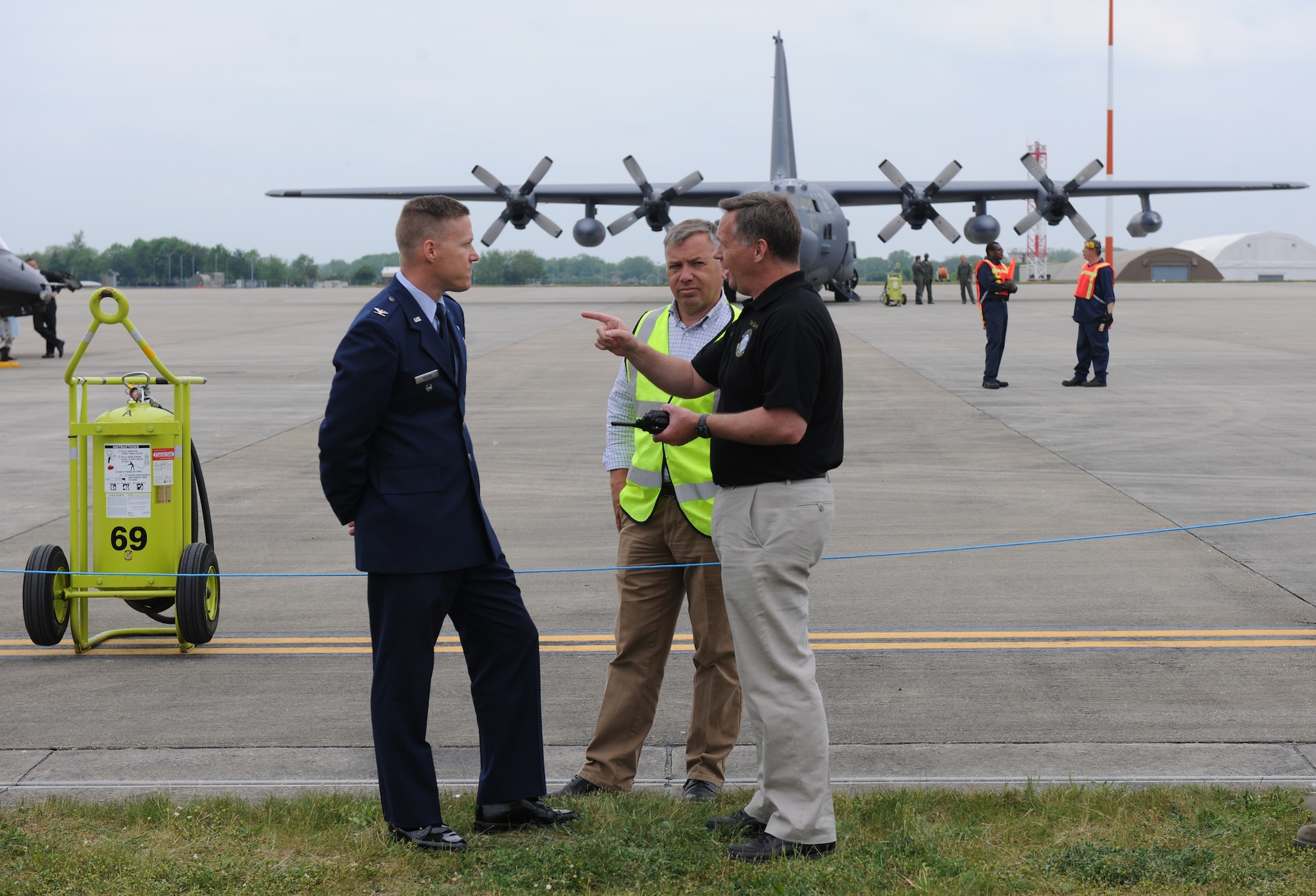 RAF FAIRFORD, United Kingdom – Col. Jeffrey Yocum, 501st Combat Support Wing vice commander, speaks with Tim Hershberger, 420th Air Base Squadron site director, and Tony Maycock, 420th ABS airfield manager, about operations during the Royal International Air Tattoo Media Launch Day May 29. (U.S. Air Force photo by Capt. Brian Maguire)