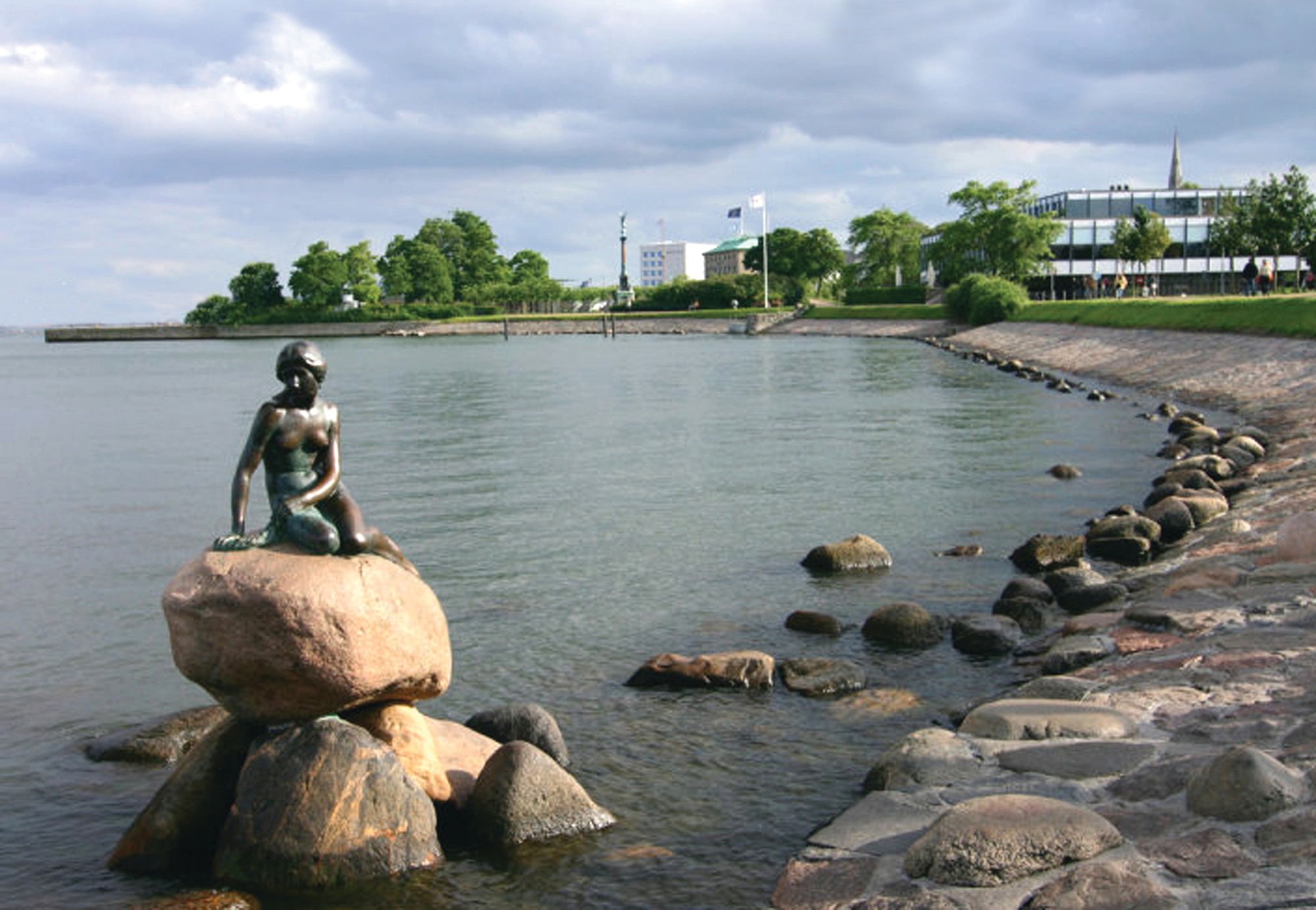 Den lille havfrue, or the Little Mermaid, was sculpted by Edvard Eriksen and sits in Copenhagen harbor. The statue was unveiled in 1913 and has since been a major tourist attraction. (Photo by Dane)