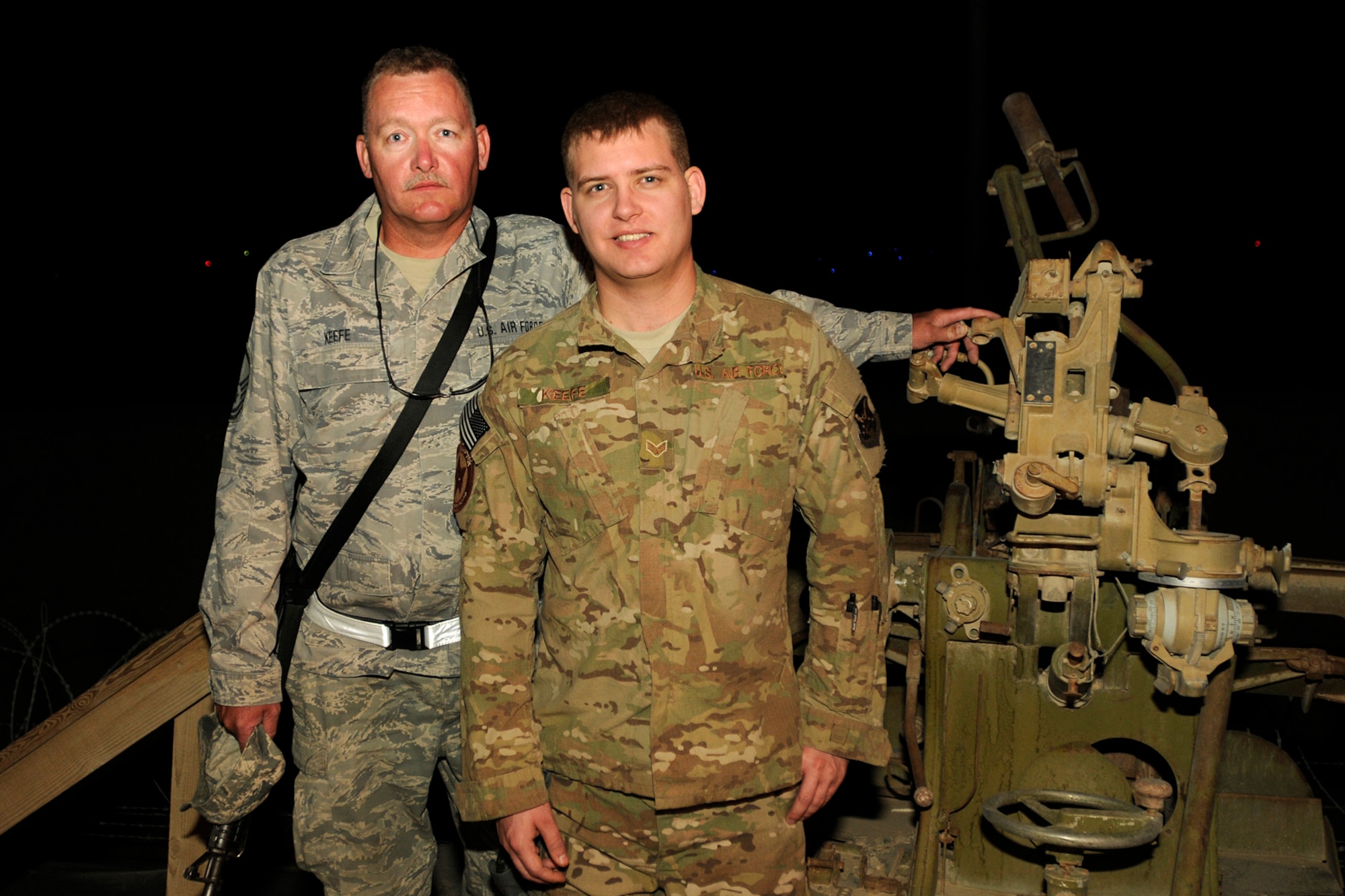 Master Sgt. Jerry Keefe, a flight line production expeditor assigned to the 451st Expeditionary Aircraft Maintenance Squadron at Kandahar Airfield, Afghanistan, and his son Senior Airman Cody Keefe, an intelligence analyst assigned to the 157th Expeditionary Fighter Squadron, pose for a photo June 6, 2012. Personnel are deployed from McEntire Joint National Guard Base, S.C., in support of Operation Enduring Freedom. Swamp Fox F-16's, pilots, and support personnel began their Air Expeditionary Force deployment early April to take over flying missions for the air tasking order and provide close air support for troops on the ground in Afghanistan.
(U.S. Air Force photo/TSgt. Caycee Cook)
