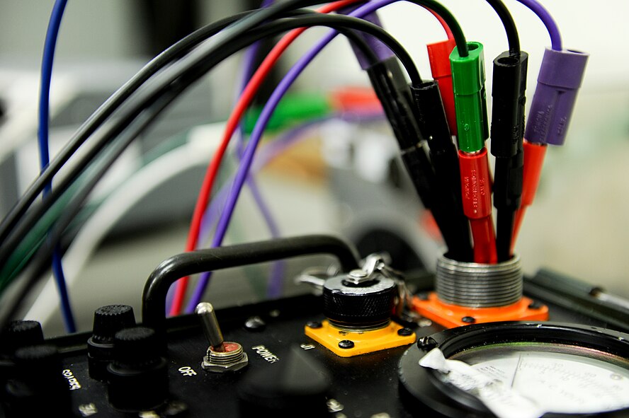 A machine is calibrated in the Precision Measurement Equipment Laboratory on Kadena Air Base, Japan, June 12, 2012. PMEL is responsible for calibrating systems from more than 200 work centers throughout the Pacific Air Forces. (U.S. Air Force photo/ Airman 1st Class Brooke P. Beers)