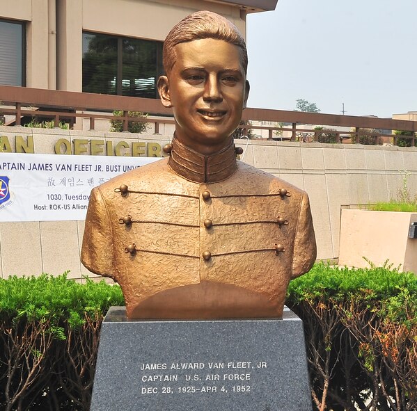 A bust of Capt. James A. Van Fleet Jr. is revealed in front of the Officers’ Club here June 12, 2012. U.S. and Republic of Korea air force leaders gathered in front of the club to honor the memorial dedicated to the Airmen who died or were injured during the Korean War. (U.S. Air Force photo/Senior Airman Adam Grant)