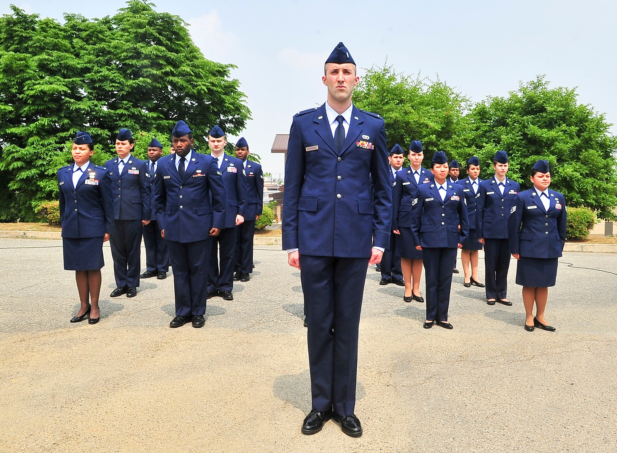 Airmen stand in formation during the Capt. James A. Van Fleet Jr. monument unveiling here June 12, 2012. The bronze statue sits in front of the Officers’ Club and is dedicated to the 1,920 U.S. Airmen killed or wounded during the Korean War. (U.S. Air Force photo/Senior Airman Adam Grant)