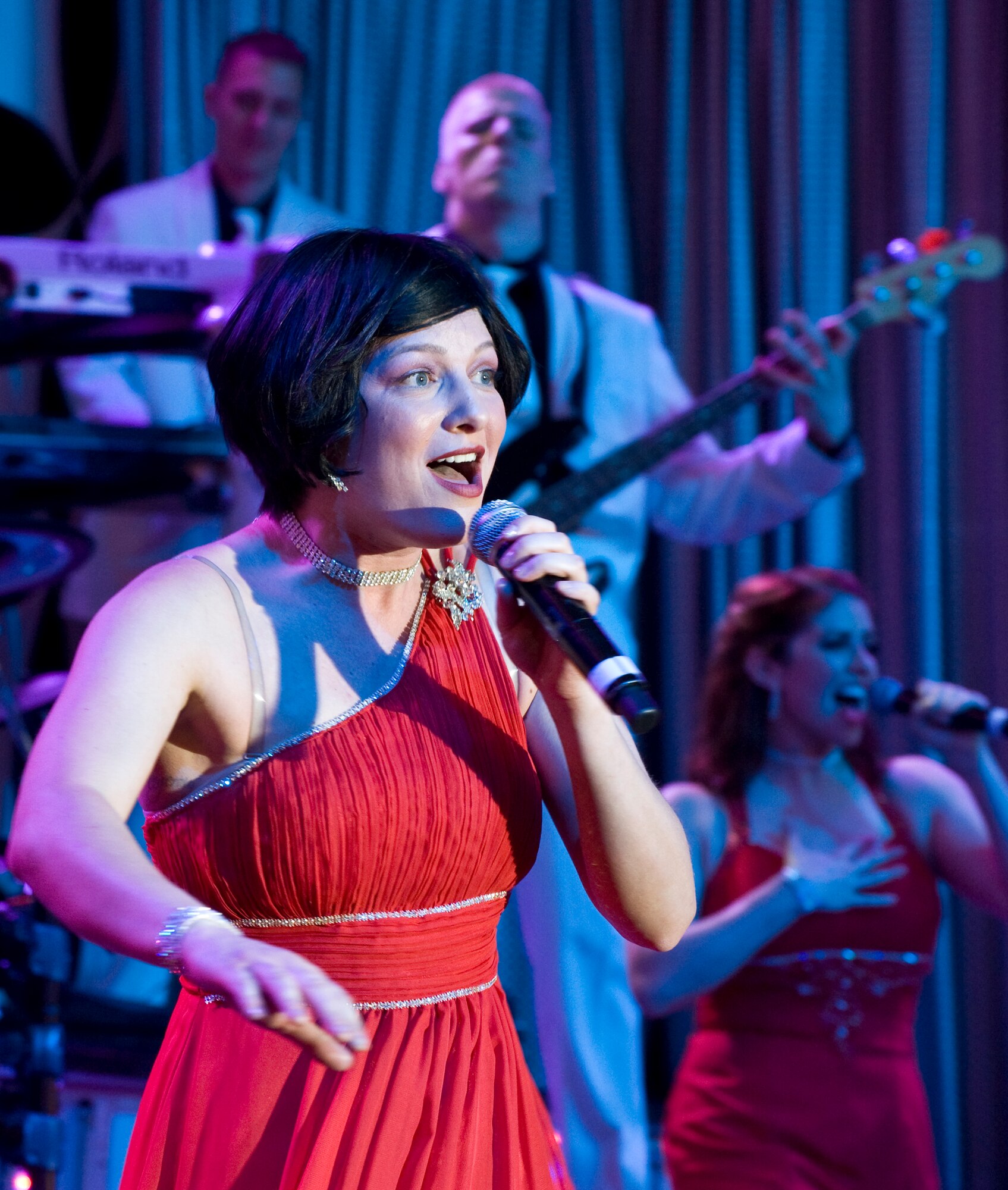 Senior Airman Joleen Dedmon, Tops in Blue vocalist, originally from the 944th Medical Squadron, Luke Air Force Base, Ariz., performs during the Tops in Blue 2012 World Tour June 8, 2012, in Las Vegas. The Tops In Blue team is an all-active duty U.S. Air Force special unit made up of performers selected for their entertainment abilities. (U.S. Air Force photo by Airman 1st Class Matthew Lancaster)