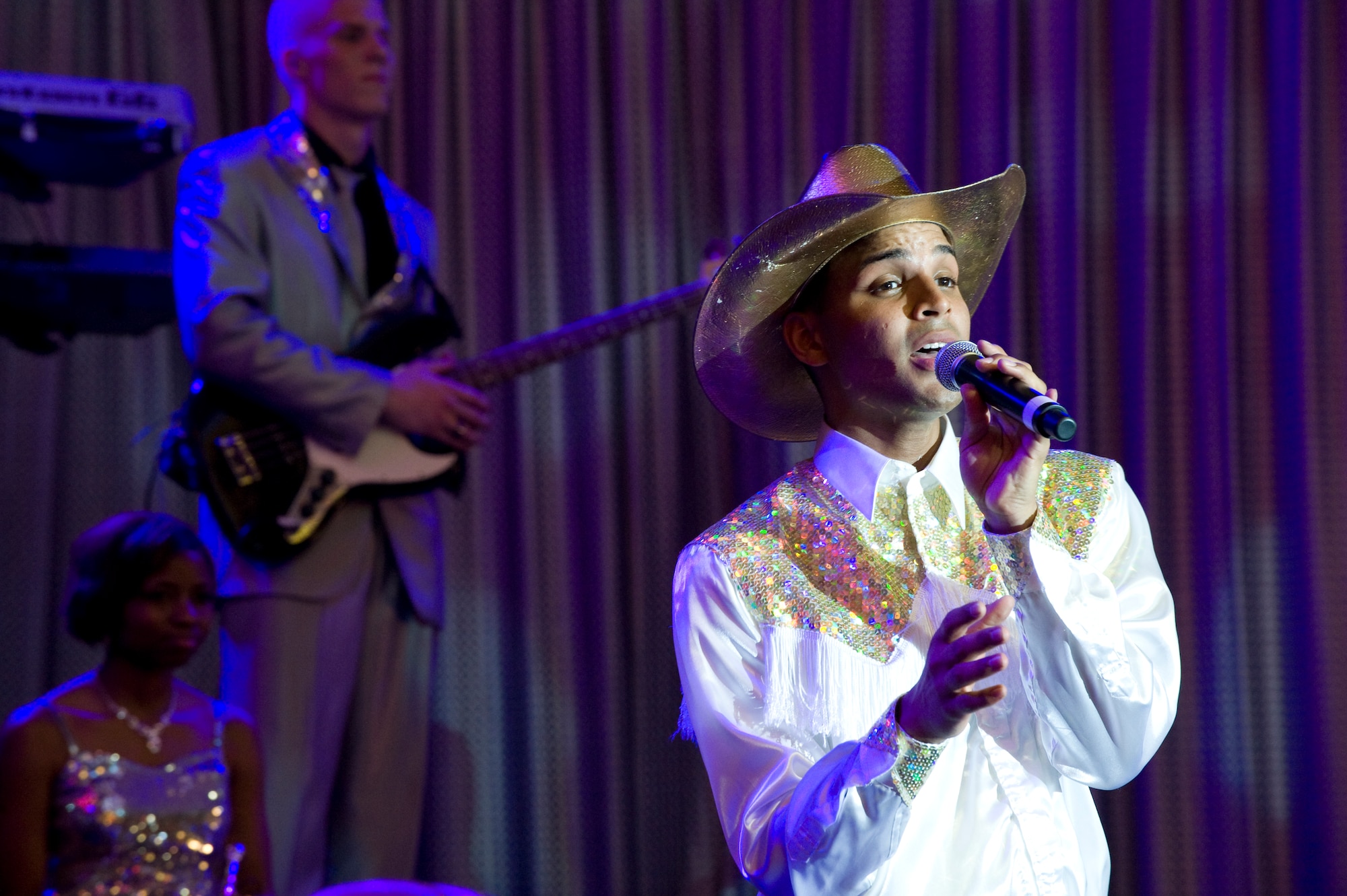 Senior Airman Emmanuel Maldonado Rosario, Tops in Blue vocalist, originally from the 81st Dental Squadron, Keesler Air Force Base, Miss., performs during the Tops in Blue 2012 World Tour June 8, 2012, in Las Vegas. Tops In Blue will be perform at over 90 locations on their international tour. (U.S. Air Force photo by Airman 1st Class Matthew Lancaster)