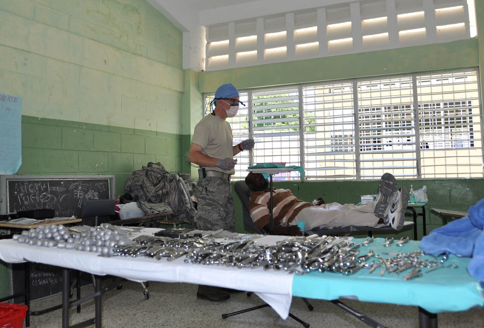 The dental section made up of six Air Force Reserve members and one Air National Guardsman set up their temporary clinic at a school in Puerta Plata, Dominican Republic last month. The U.S. personnel were augmented by one local dentist to assist with the high capacity of patients. The team saw 656 people over 15 days and conducted more than 825 tooth extractions. (U.S. Air Force photo/Maj. Myla Abejuela)