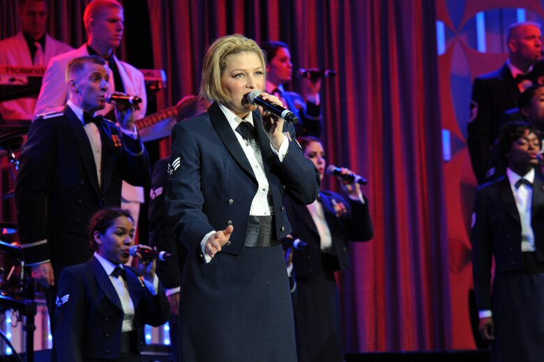 U.S. Air Force Senior Airman Joleen Dedmon, 944th Medical Squadron, Luke Air Force Base, Ariz., leads the 2012 Tops in Blues performers in the final number of their show at the Tucson Convention Center music hall in Tucson, Ariz., June 3, 2012. The crowd, which mostly consisted of Davis-Monthan AFB Airmen and affiliates, gave a standing ovation for Dedmon and the rest of the performers. (U.S. Air Force photo by Airman 1st Class Timothy D. Moore/Released)