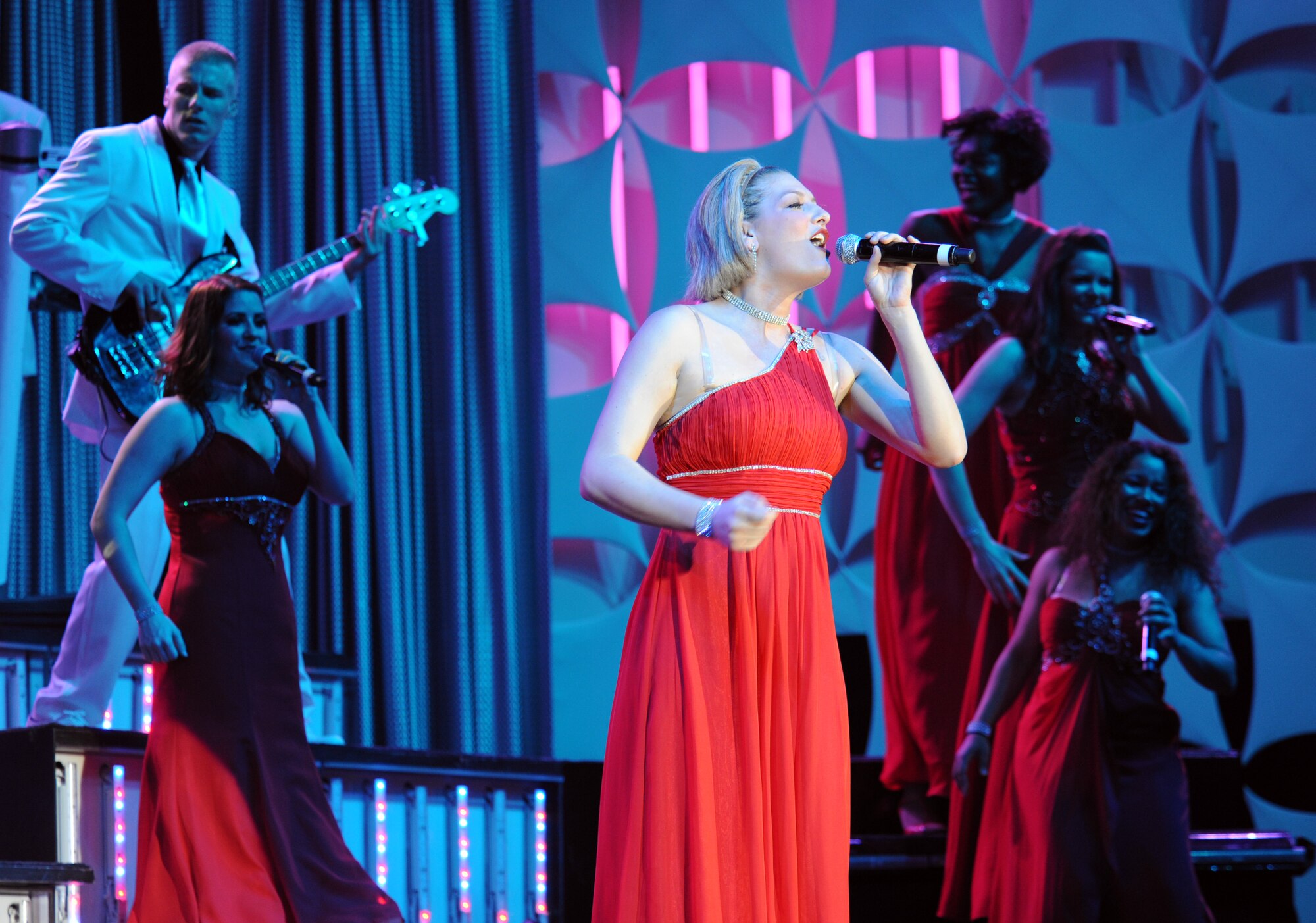 U.S. Air Force Senior Airman Joleen Dedmon, 944th Medical Squadron Luke Air Force Base, Ariz., leads the female ensemble of the 2012 Tops in Blues in a musical number at the Tucson Convention Center music hall in Tucson, Ariz., June 3, 2012. Dedmon, an Air Force reservist, works at the 355th Contracting Squadron on Davis-Monthan AFB, Ariz. when not in active status. (U.S. Air Force photo by Airman 1st Class Timothy D. Moore/Released)