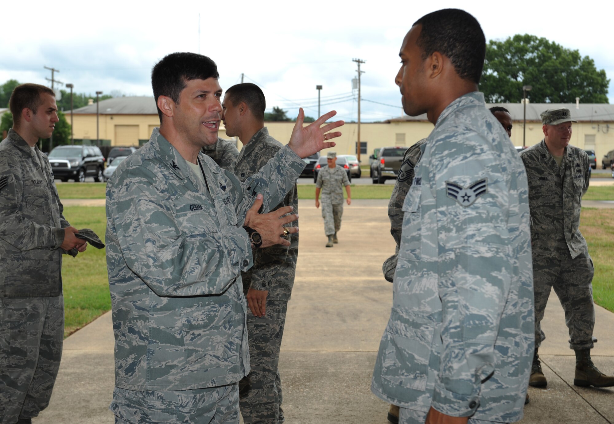 Col. Andrew Gebara, 2nd Bomb Wing commander, speaks with Senior Airman Aaron Semple, 2nd Aircraft Maintenance Squadron, during the Airman Leadership Open House on Barksdale Air Force Base, La., June 12. The Open House is an opportunity for commanders, superintendents, first sergeants and supervisors to visit and speak with their Airmen at the midway point of their ALS curriculum. (U.S. Air Force photo/Airman 1st Class Benjamin Gonsier)(RELEASED)