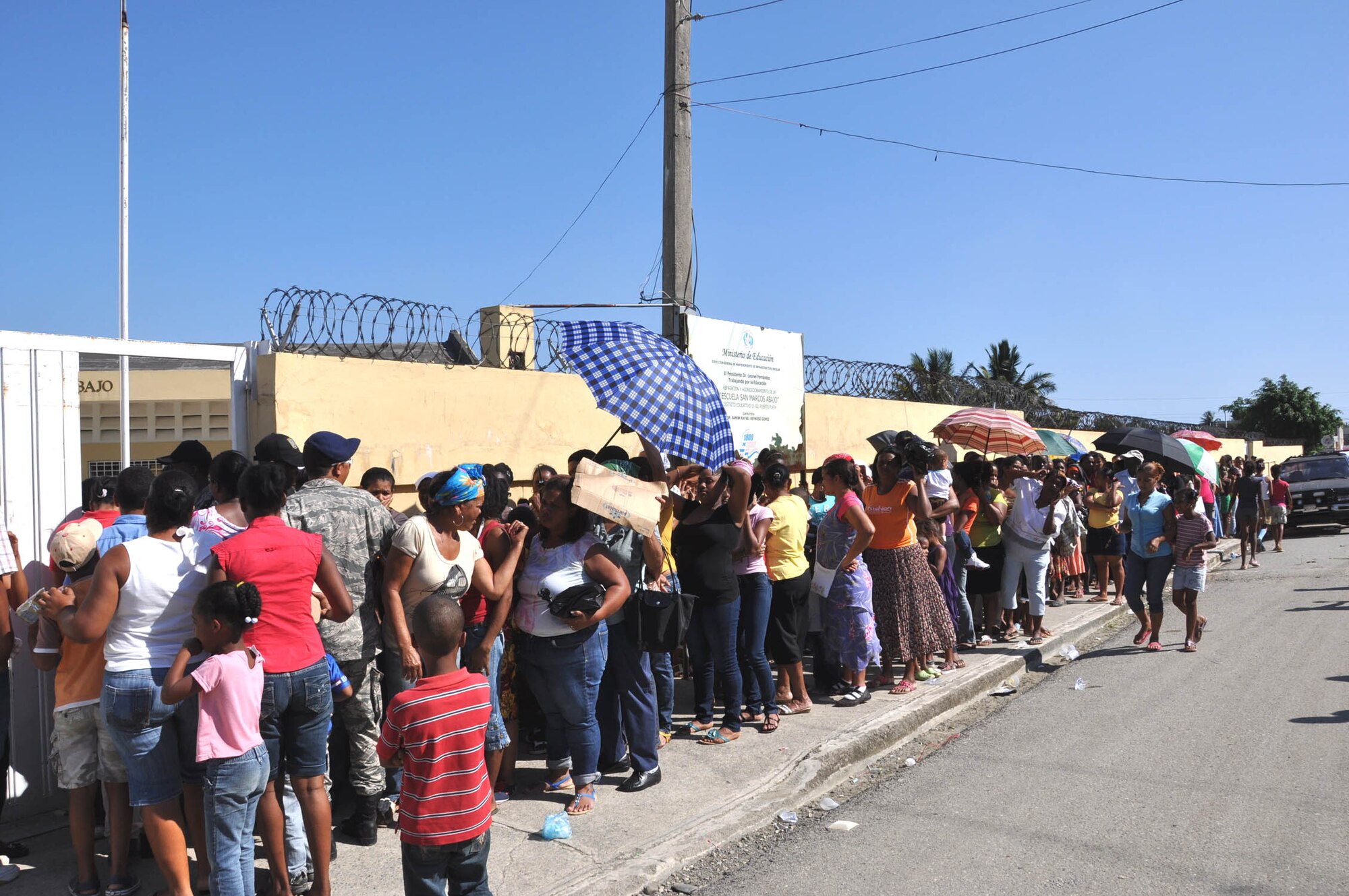 Patients wait to be seen at a temporary medical clinic housed in a local school in Puerto Plata, Dominican Republic. Members of the 926th Aerospace Medical Squadron partnered with Reserve and Guard members from nine different units last month for a humanitarian mission that provided care to more than 10,000 patients over the course of 15 days. (U.S. Air Force photo/Maj. Myla Abejuela)