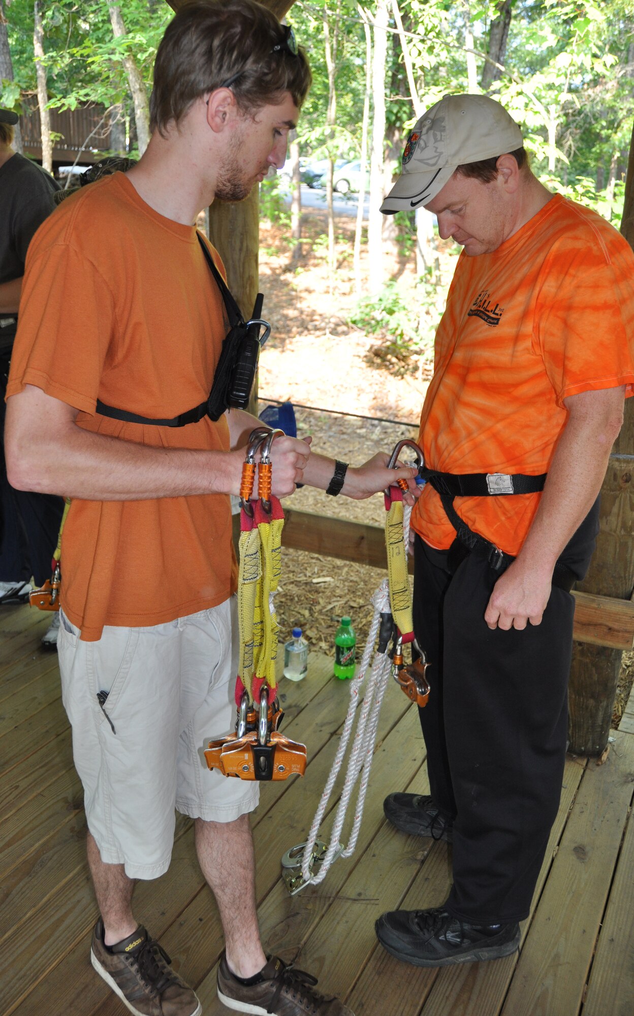 George Carper from the 94th Force Support Squadron is strapped to his locking carabineer in preparation for the Zip Line Tour during the Single Airman Initiative in historic Banning Mills, GA May 19. Since its inception in October 2011, SAI programs have appeared in more than 50 base installations due to its growing popularity and avenue for single airman to build long-lasting relationships while participating in fun activities that won't hurt one's pockets.