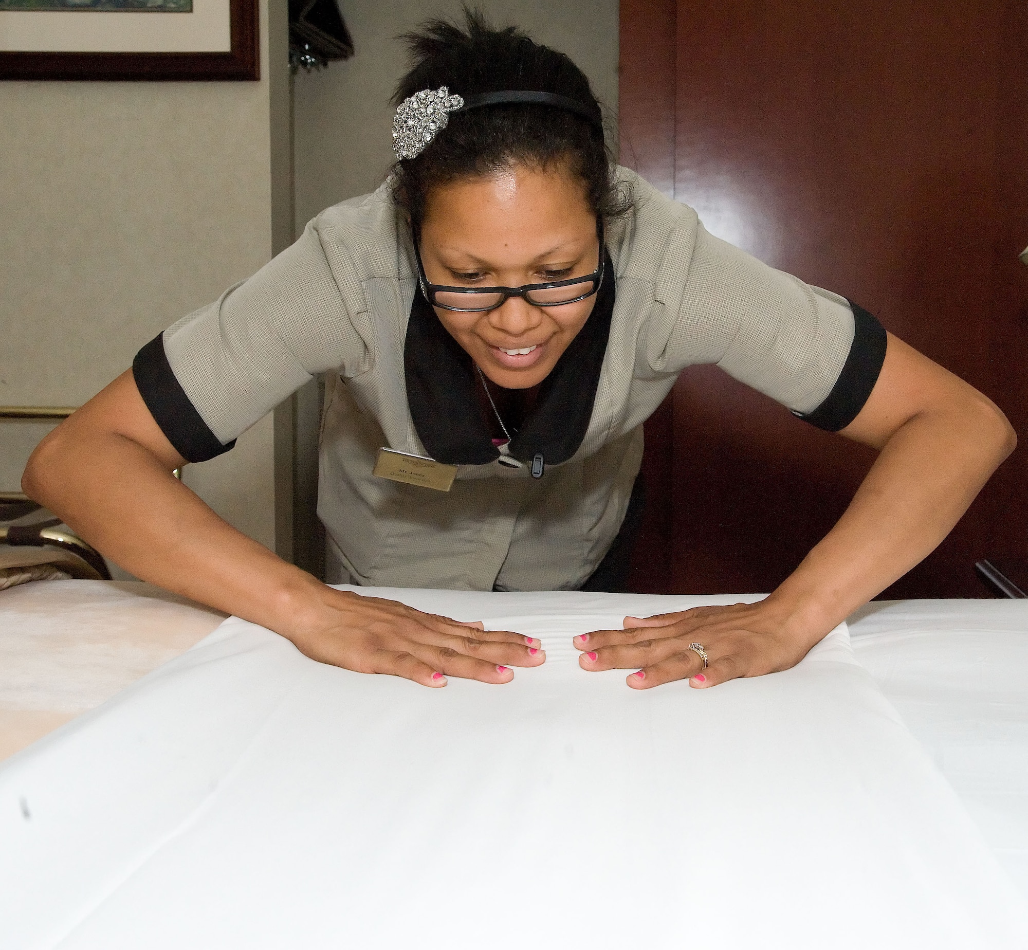 Debora Pineiro, a member of the housekeeping staff at the Eagles’ Rest Inn, changes the linens in a guest room at the Eagles’ Rest Inn June 4, 2012, at Dover Air Force Base, Del. The Eagles’ Rest Inn hosts a variety of guests from throughout the Department of Defense. (U.S. Air Force photo by Adrian R. Rowan)