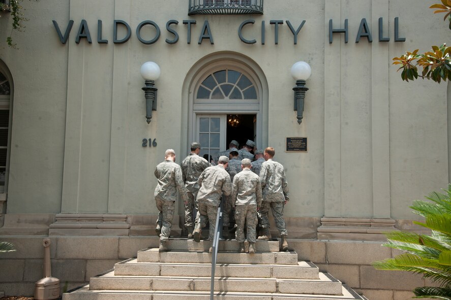 U.S. Air Force Academy cadets walk into Valdosta City Hall during a community interaction day at Valdosta, Ga., June 5, 2012, as part of the Operation Air Force program. Ops Air Force is a three-week summer program that allows cadets to visit various bases and experience the operational Air Force first hand. (U.S. Air Force photo by Airman 1st Class Paul Francis/Released)

