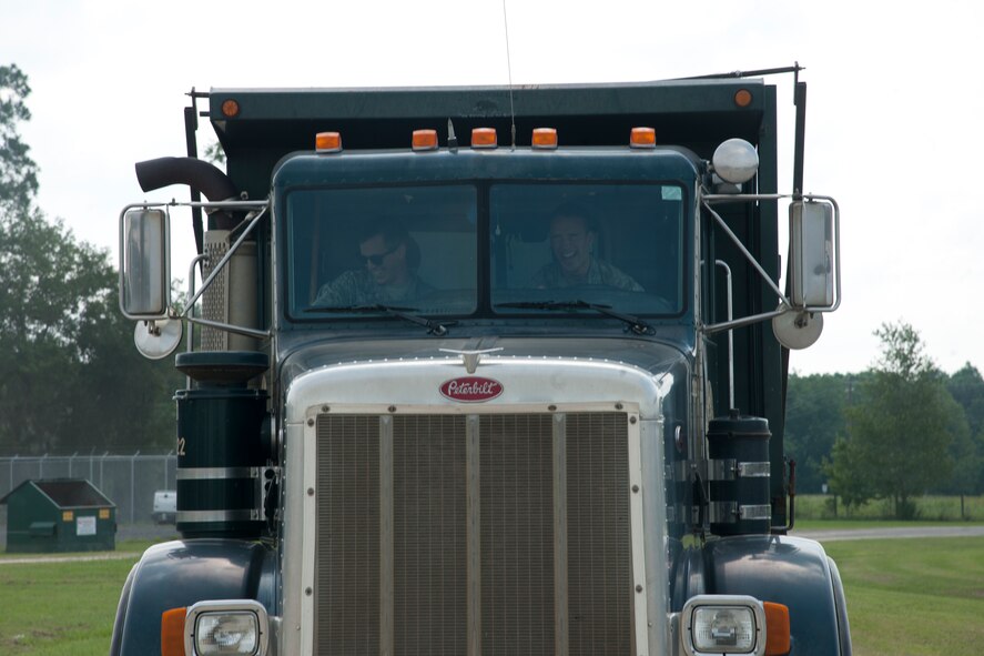 U.S. Air Force Academy cadet Kyle Mahan drives a dump truck at Valdosta Public Works in Valdosta, Ga., as part of a community interaction day June 5, 2012. Each cadet competed in an obstacle course that included reverse maneuvers, parking and turns. (U.S. Air Force photo by Airman 1st Class Paul Francis/Released)  
