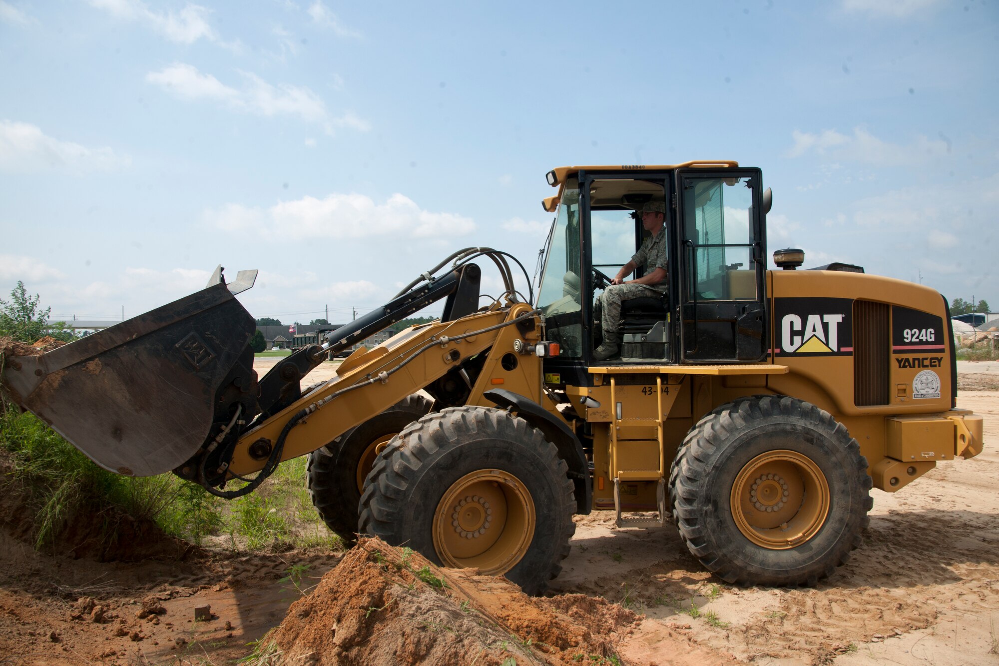 U.S. Air Force Academy cadets work a front-end loader at Valdosta Public Works in Valdosta, Ga., June 5, 2012, as part of a community interaction day. A group of 10 cadets are currently visiting Moody Air Force Base, Ga., for nearly three weeks to get a taste of operational Air Force life and careers. (U.S. Air Force photo by Airman 1st Class Paul Francis/Released)
