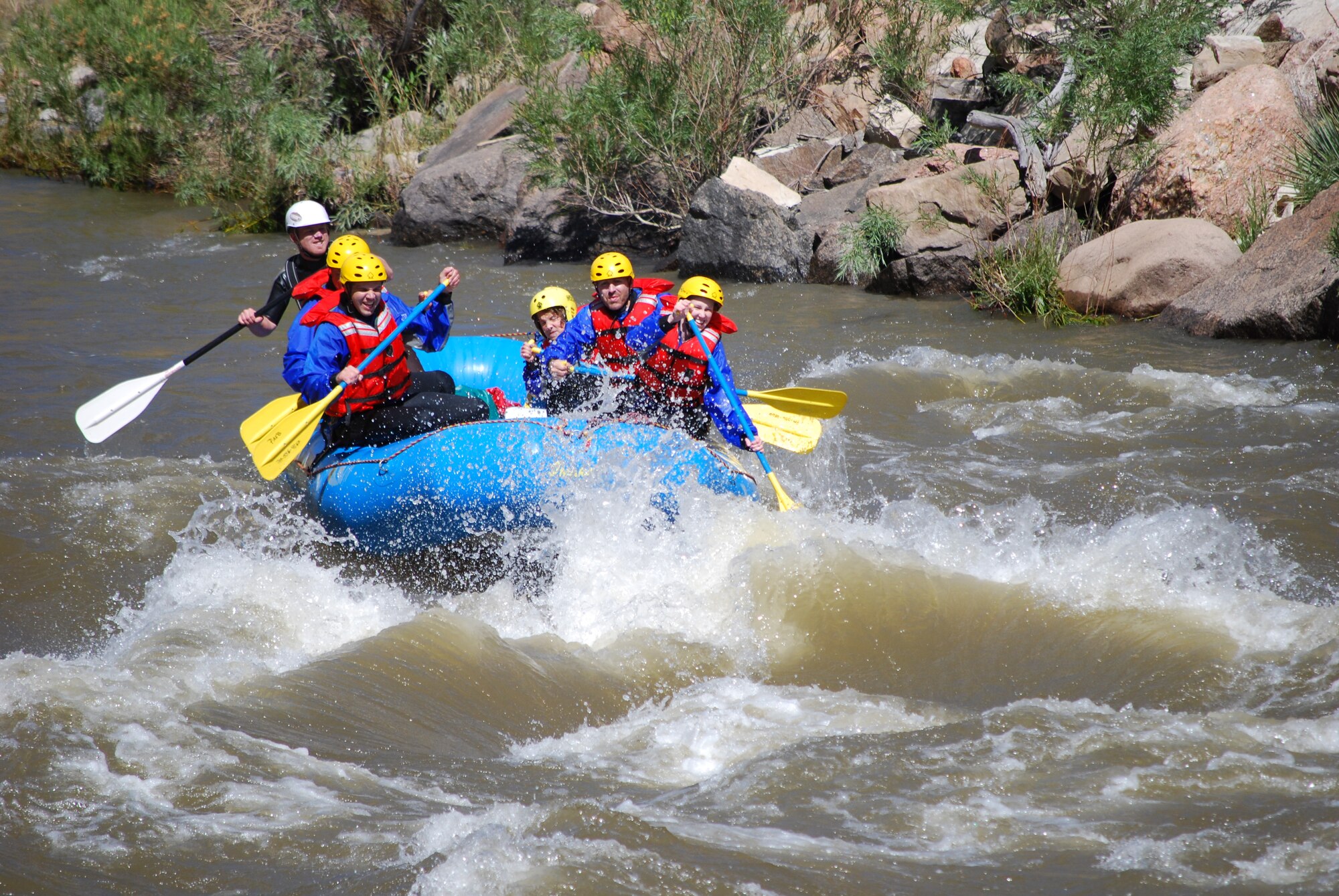 A group of rafters on a Peterson Outdoor Recreation trip maneuver a rapid on the Arkansas River. Outdoor Rec takes three rafting trips a week during the summer. (Courtesy photo)