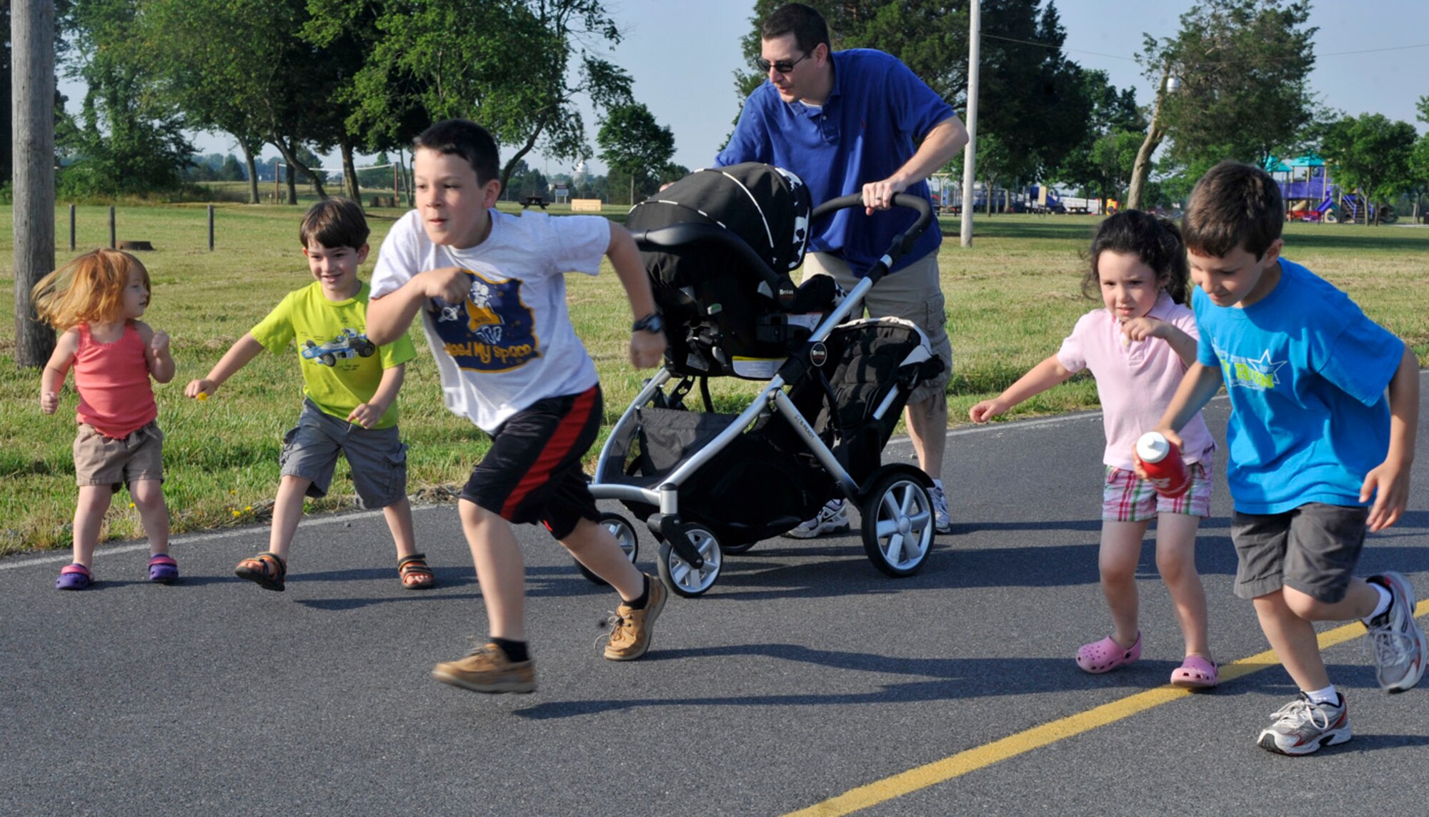 Children sprint at the start of the "Kiddie K" race June 10, 2012, at the Air Mobility Command Museum on Dover Air Force Base, Del. The "Kiddie K" was held before the start of the Heritage Half-Marathon and 5K. (U.S. Air Force photo by Tech. Sgt. Chuck Walker)