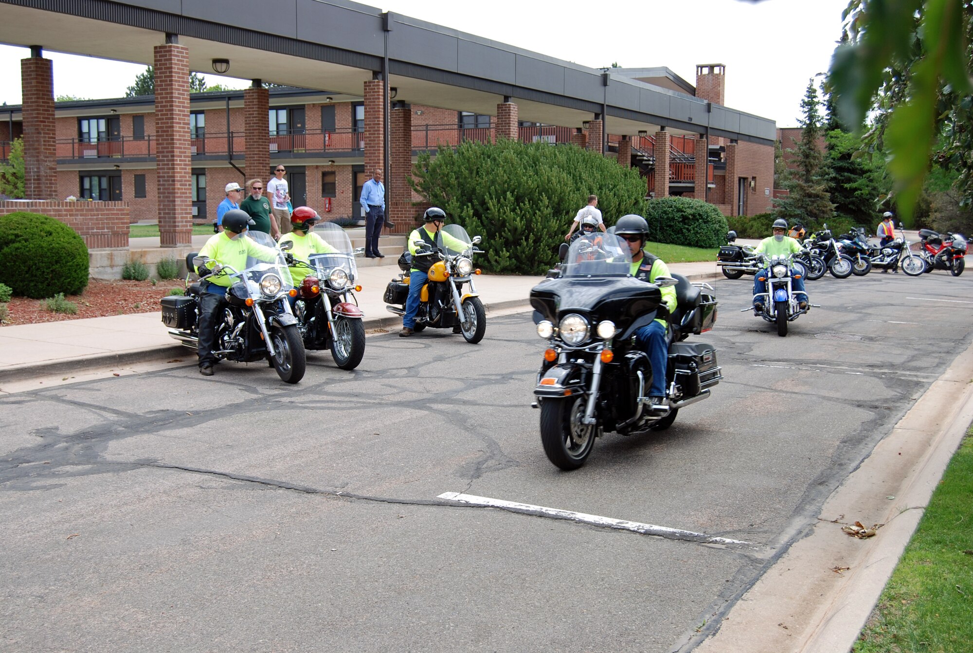 PETERSON AIR FORCE BASE, Colo. - A group of motorcycle riders take off on a poker run June 5, 2012. The ride was sponsored by the Peterson Air Force Base Diamond Council, and hamburgers and hot dogs were provided by the first sergeants. As part of the Critical Days of Summer campaign, the safety office sponsored a motorcycle safety briefing before the ride. (U.S. Air Force photo/Lea Johnson)