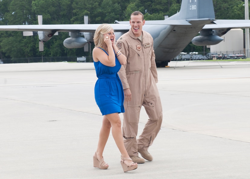 U.S. Air Force Capt. Nick Pettit, 71st Rescue Squadron, walks with his fiancé Candy after returning from a four-month deployment to Afghanistan June 8, 2012, at Moody Air Force Base, Ga. After stepping off the plane, Pettit proposed to Candy. (U.S. Air Force photo by Senior Airman Eileen Meier/Released)