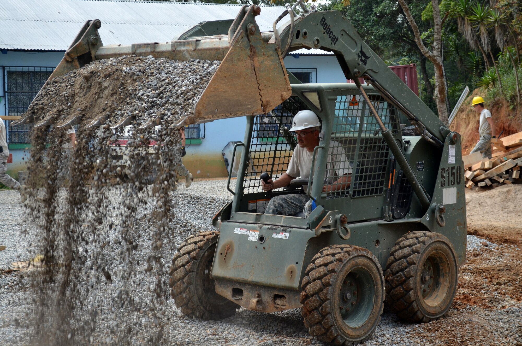 Airmen with the 188th Civil Engineer Squadron labor to complete a structure near the Guatemalan village of Tactic, the site of Beyond the Horizon (BTH) 2012. The 188th CES deployed three teams in three, separate two-week rotations to Guatemala to support BTH, a U.S. Army South-led humanitarian aid and military engineering exercise demonstrating U.S. support and commitment to Guatemala. (National Guard photo by Lt. Col. Tenise Gardner/188th Fighter Wing)