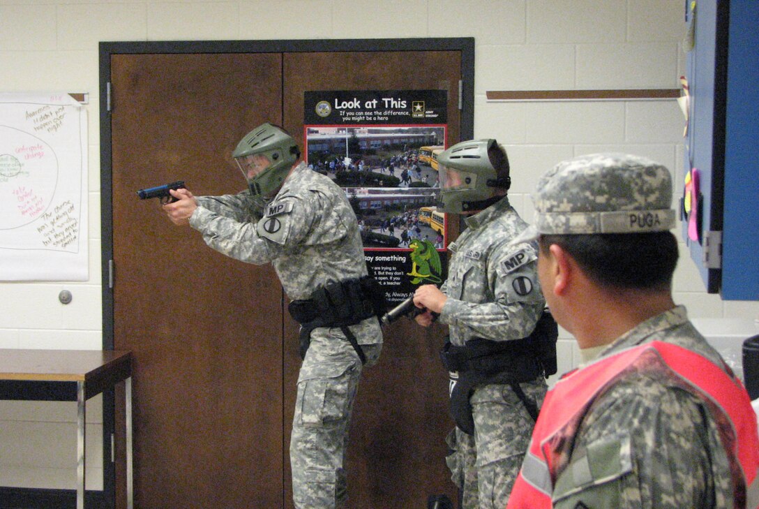U.S. Army Spec. Brian Williamson, left, and Sgt. Kevin Belanger, center, both with the 221st MP Detachment, respond to an active-shooter scenario June 4, during the 3rd Annual Private 1st Class Boyd Jr. Top Cop Competition at Ft. Jackson, S.C. Williamson went on to win the Soldier’s division of the the competition. (Courtesy photo)
