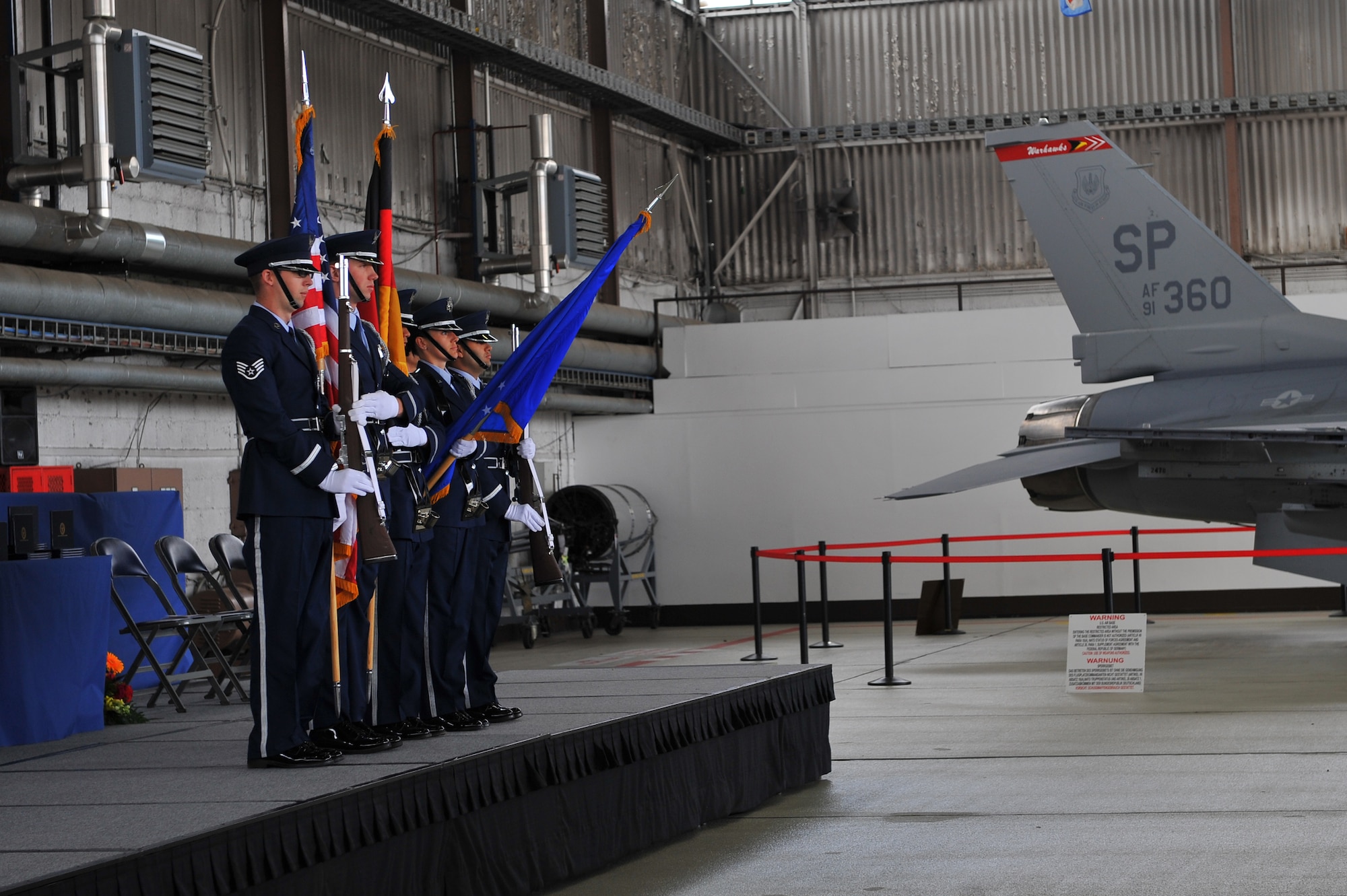 SPANGDAHLEM AIR BASE, Germany – Members of the 52nd Fighter Wing Honor Guard post the colors during the Bitburg High School graduation ceremony inside Hangar 1 here June 9. The class of 2012 consisted of 54 students. More than 300 family members and guests attended the ceremony to celebrate the completion of their high school education. (U.S. Air Force photo by Airman 1st Class Dillon Davis/Released)