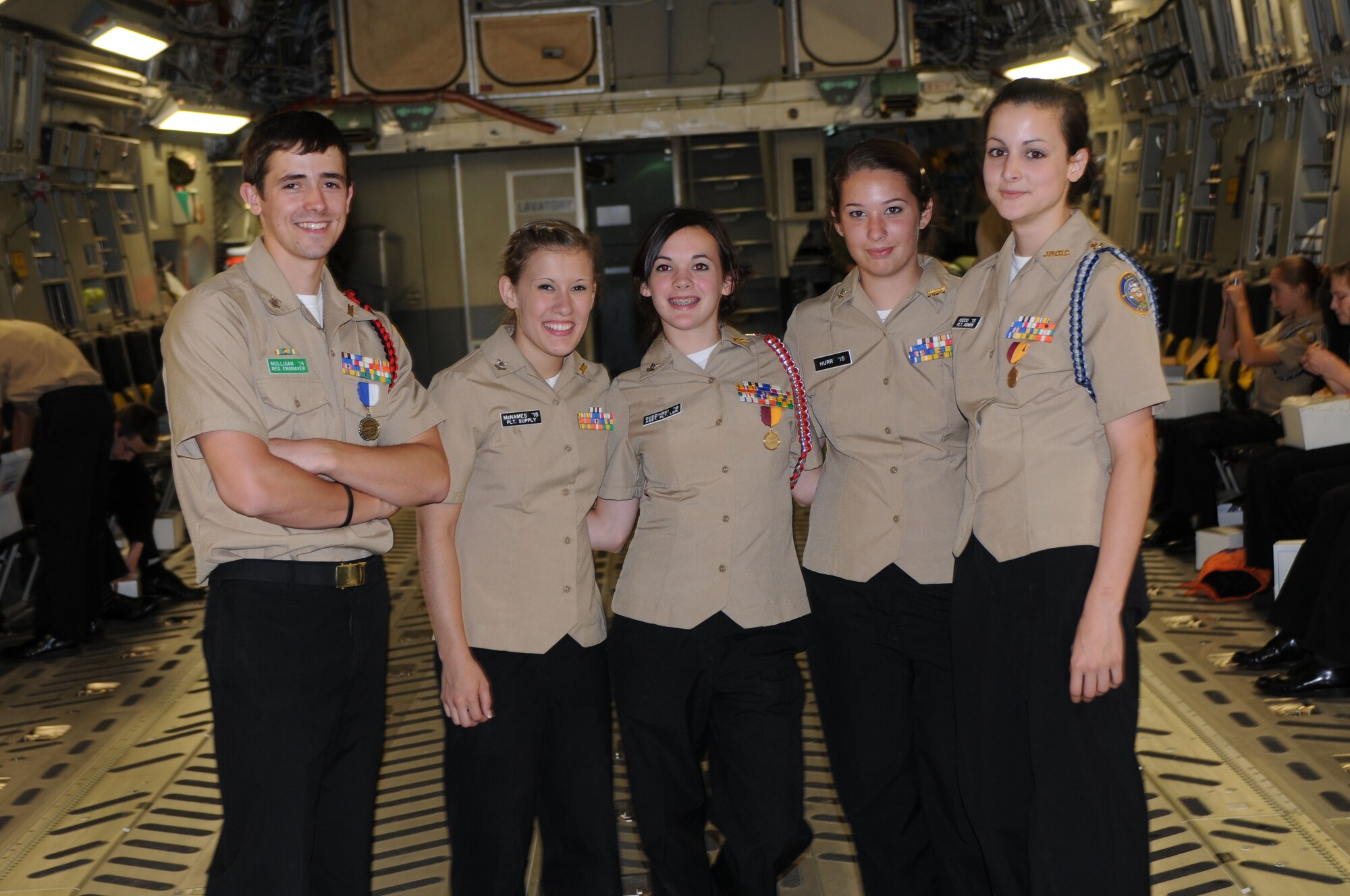 Navy Junior ROTC cadets (left to right) Jesse Mulligan, Shannon McNames, Ellen Dudzinski, Meaghan Hurr and Catherine Iocco pose for a photo June 9, 2012, aboard a C-17 Globemaster III from Dover Air Force Base, Del. The cadets visited the base to learn about its missions after finishing their school year at the Delaware Military Academy. (U.S. Air Force photo by Senior Airman Joe Yanik)
