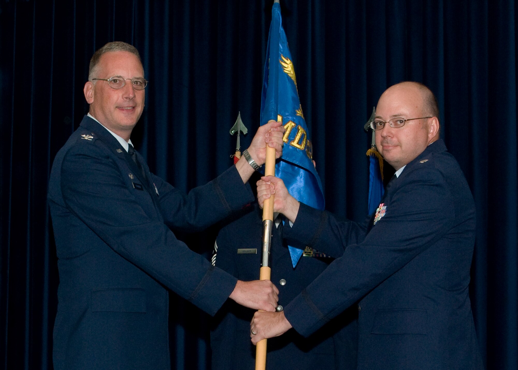 Lt. Col. Jonathan Richards (right) assumes command of the 39th Medical Support Squadron from Col. Jay Cloutier, 39th Medical Support Squadron, June 11, 2012 at Incirlik Air Base, Turkey. Col. Jay Cloutier, 39th MDG commander, was the presiding officer for the ceremony. (U.S. Air Force photo by Senior Airman Marissa Tucker/Released)
