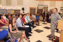 Lt. Col. Danny Johnson, 902nd Mission Support Group vice commander, talks to scholarship winners and their parents at the scholarship award ceremony held at the commissary at Joint Base San Antonio-Randolph, Texas June 7.  (U.S. Air Force photo by Rich McFadden) 