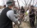 Local farmers gather around a budding tree to observe pruning techniques during a hands-on exercise March 15 outside of Shindand Air Base, Herat Province, Afghanistan. These practical exercises were part of an agricultural capacity building workshop initiated by a joint team representing Afghan air force installation advisors, the U.S. Agency for International Development, the U.S. Department of Agriculture and Army Civil Affairs in partnership with the Afghan air force installation leadership, district governor and local authorities. The workshop focused on developing skills in support of local and future agricultural development. (Courtesy photo) 