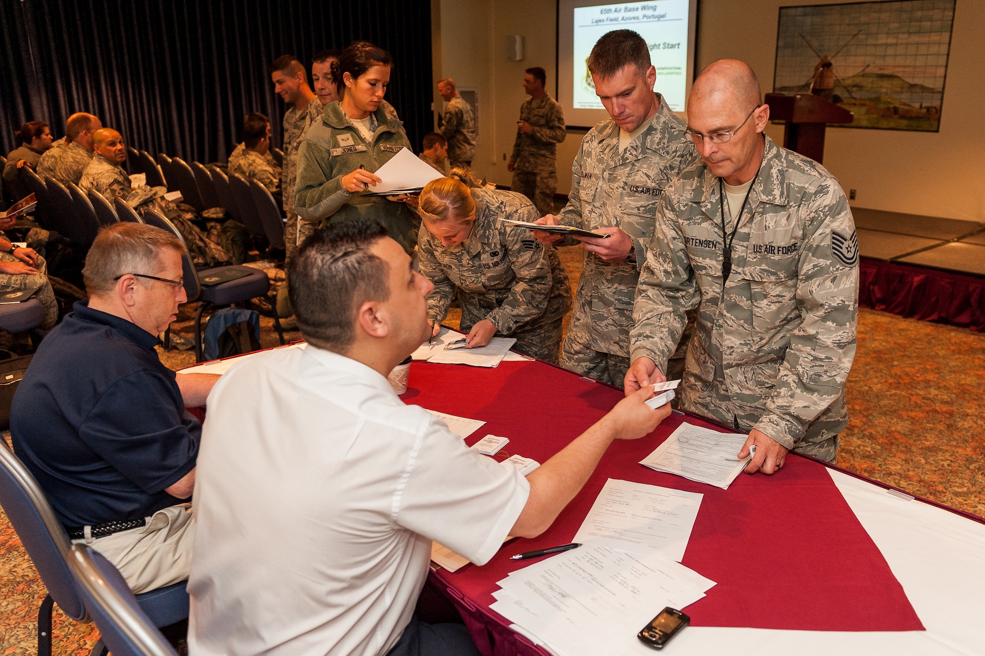 Members from the 419th Logistics Readiness Squadron from Hill Air Force Base, Utah, receive lodging keys during an annual exercise at Lajes Field, Azores, on June 8, 2012.  (U.S. Air Force photo by Lucas Silva)  