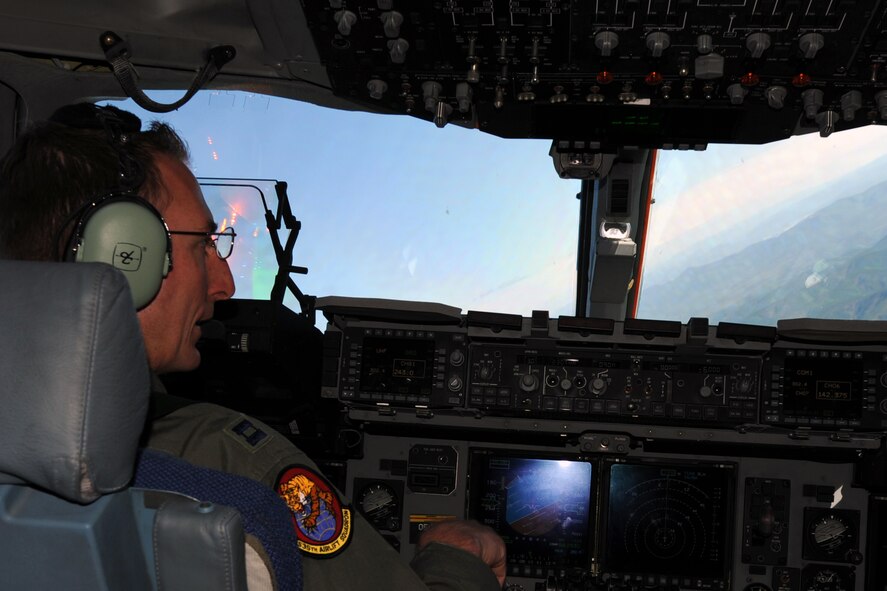 Capt. Mat Klingenberg, a pilot from the 535th Airlift Squadron at Joint Base Pearl Harbor-Hickam, Hawaii, steers a C-17 Globemaster III aircraft through a turn during a low-level orientation flight June 11 as part of the RED FLAG-Alaska military exercise. RED FLAG-Alaska is one of the largest international air-combat employment exercises in the world and is designed to test the specific capabilities of the military units that take part in the exercise and increase their chance of survival during actual combat. (U.S. Air Force photo by Capt. Ben Sakrisson)