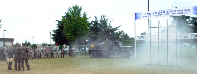Republic of Korea Air Force members from the 38th Fighter Group show off their decontamination aerial sprayer June 8, 2012, at Kunsan Air Base, Republic of Korea, during training with Airmen from several Pacific Air Forces bases. The larger-scale capability of decontaminating people and vehicles saves time after chemical attacks. (U.S. Air Force photo/Senior Airman Brigitte N. Brantley)
