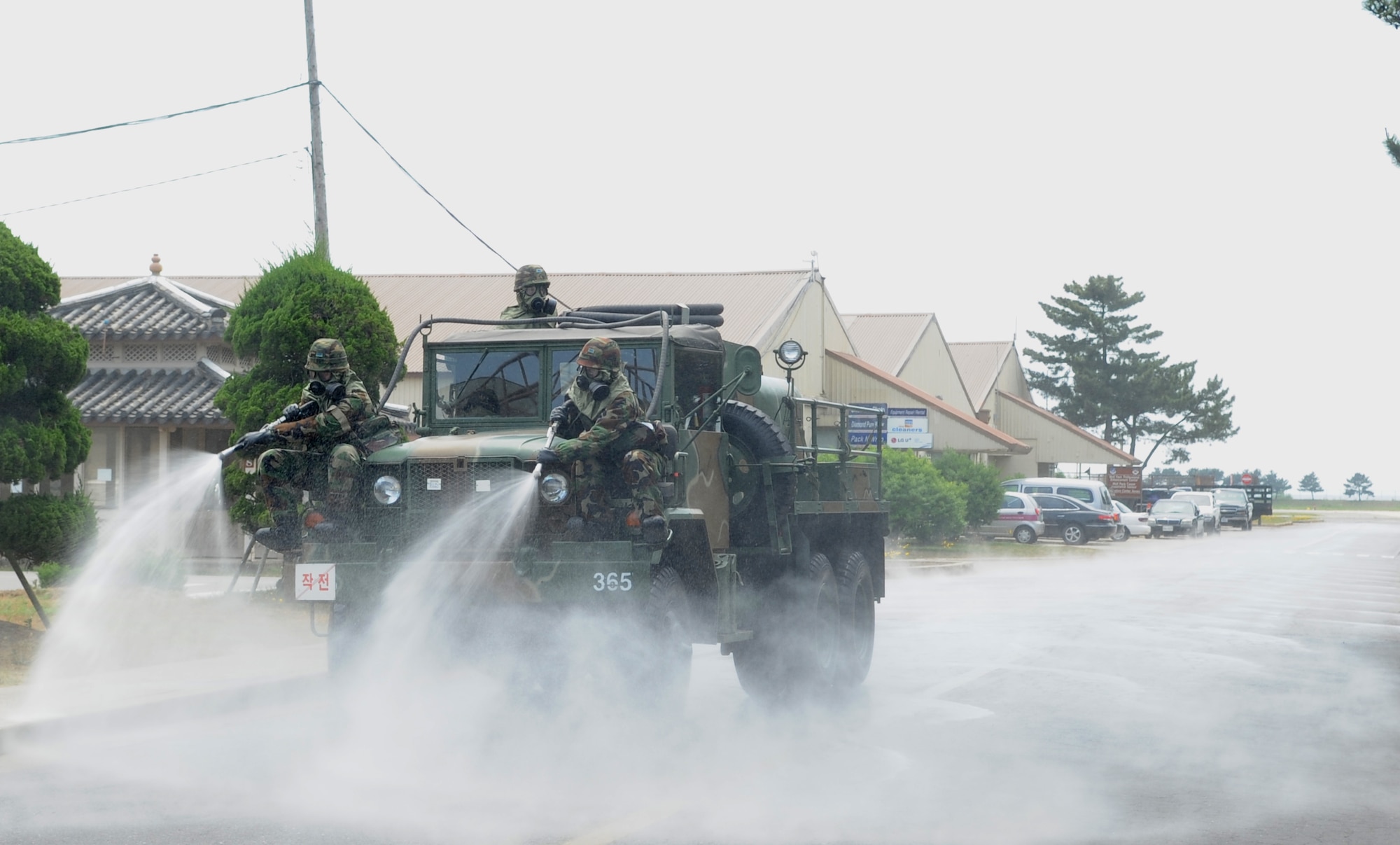 Republic of Korea Air Force members show off a decontamination vehicle from their arsenal June 8, 2012, at Kunsan Air Base, Republic of Korea, during joint training with Pacific Air Forces bases. The training gave American and Korean Airmen the chance to discuss differences in training and equipment. (U.S. Air Force photo/Senior Airman Brigitte N. Brantley)